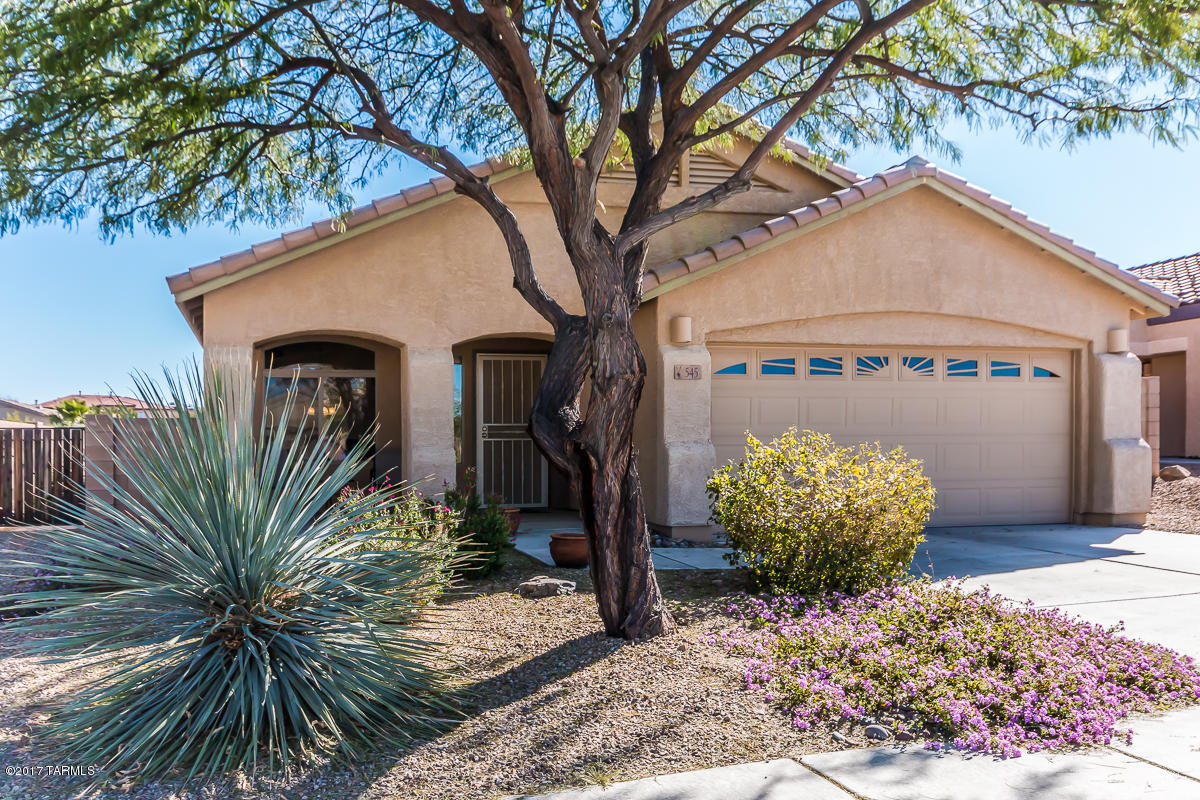 Range Priced: Seller to accept/counter offers between $175,000-$180,000. Clean, neat and ready for you! Enjoy the backyard that backs up to common area (instead of another home) on your covered patio with extended pavers. Low care landscaping front and back means more time for you! Kitchen has staggered height maple cabinets with crown molding, Corian counters with pull out faucet, fridge & convection microwave included. The master has a large walk in closet with high/low rods and bathroom features dual sinks built in to the marble countertop and garden tub/shower combo. Vaulted height ceilings makes the house feel more open and spacious. This house also includes surround sound in the living room, a security door and alarm system, soft water system and newer water heater. Plus, a beautiful park around the corner with ramada, BBQ, shade trees & grassy area!