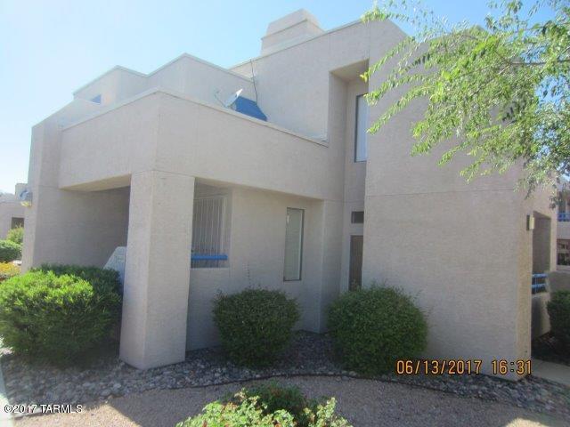 This is really Affordable living with an excellent location on east side of Tucson. This upper level unit is spacious and open with an upper private Balcony with a storage closet (which was resurfaced 6 months ago with a 4 year warranty, storage closet has a new doors)The Great Room has high Ceilings with relaxing Fireplace. Formal Dining Area off of the Great Room. Also a really nice galley Kitchen Abundant Cabinet Space with a separate Breakfast Nook. This unit has 2 nice sized Bedrooms with a really nice Master Retreat with nice closet space. This Light, Bright unit is flooded with natural light. Also located in the back of the complex, so an excellent location. This also comes with all appliances including a stacked Washer/Dryer unit. Electric Forced Air unit was replaced 9 months ago (with a 2 year service agreement) You will enjoy showing this unit. The complex has 2 large really nice below ground pools. Plus this unit comes with a covered carport.