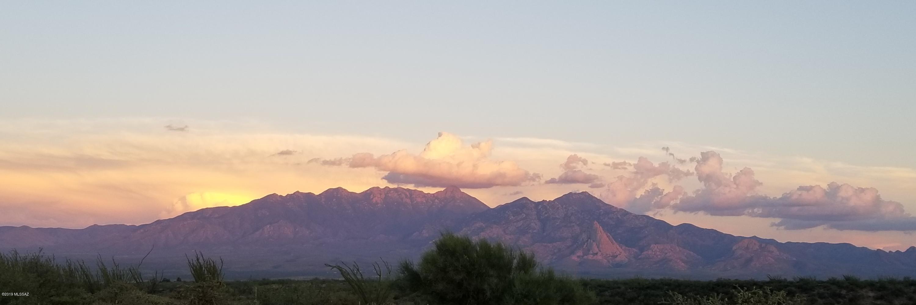 Panoramic Mountain Views.  4  mountain ranges including the expansive Santa Ritas.   Country style living,  Great building site,  1/3 interest in shared well (well installed in 2017).  Water and electric on lot line.  No HOA.  .8 miles from Calle Tres.  Floorplan (s ) available for this property.