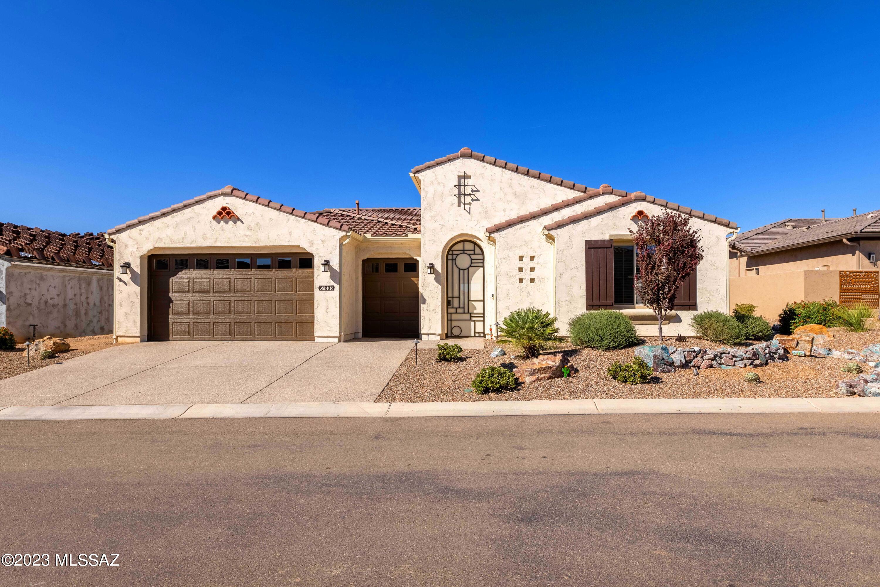 Welcome home to this rare and stunning Pavona model home built in 2021 with elegant, upgraded features and storage galore. Walk in and be amazed by the expansive great room views to arroyo greenspace and walking paths. Quartz countertops, upgraded stainless appliances, designer tile backsplashes and modern fixtures make the chefs kitchen and great room an entertainer's delight. Split bedroom floor plan for ultimate privacy and large den/office with double doors. Cozy guest suite with en-suite bath for your guest's comfort. Primary suite has gorgeous views with walk in shower and upgraded closet system for organization. Outdoor space and covered patio lead to fully fenced, private yard with gorgeous sunrise and sunset views. Expanded garage for a work area, large vehicle or storage.
