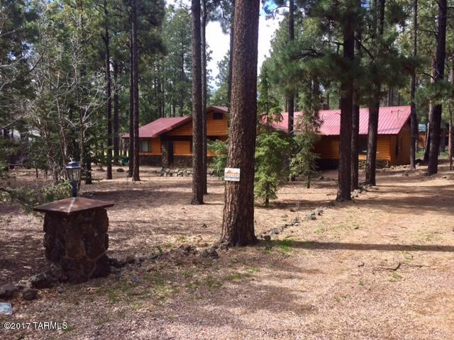 Gorgeous log sided Cabin, Entertainers Dream right in Pinetop, AZ on the Pinetop Country Club Golf course! 4 bd(all w/own baths) 5 baths. 2.5  car garage PLUS 6 car carport. Great room w/ vaulted wood ceilings, rock fp, walls of windows all overlooking the fairway. Full Deck off back of home. Spacious Kitchen w/professional SS appliances granite/rock countertops.   Travertine or Berber floors, 'real wood' doors, updated Kitchen/Baths w/granite, 'Toto' toilets, 3 bedrooms w/own access to the back, 'newer Trex deck' w/ log rails partially covered with fire pit/gas grill/furnishings all staying.   2 dining areas + large granite island to serve you family & friends that come up over weekends.Been successful VRBO so can partially pay for itself! Cool off,enjoy, No better buy on 'the Mountain!'