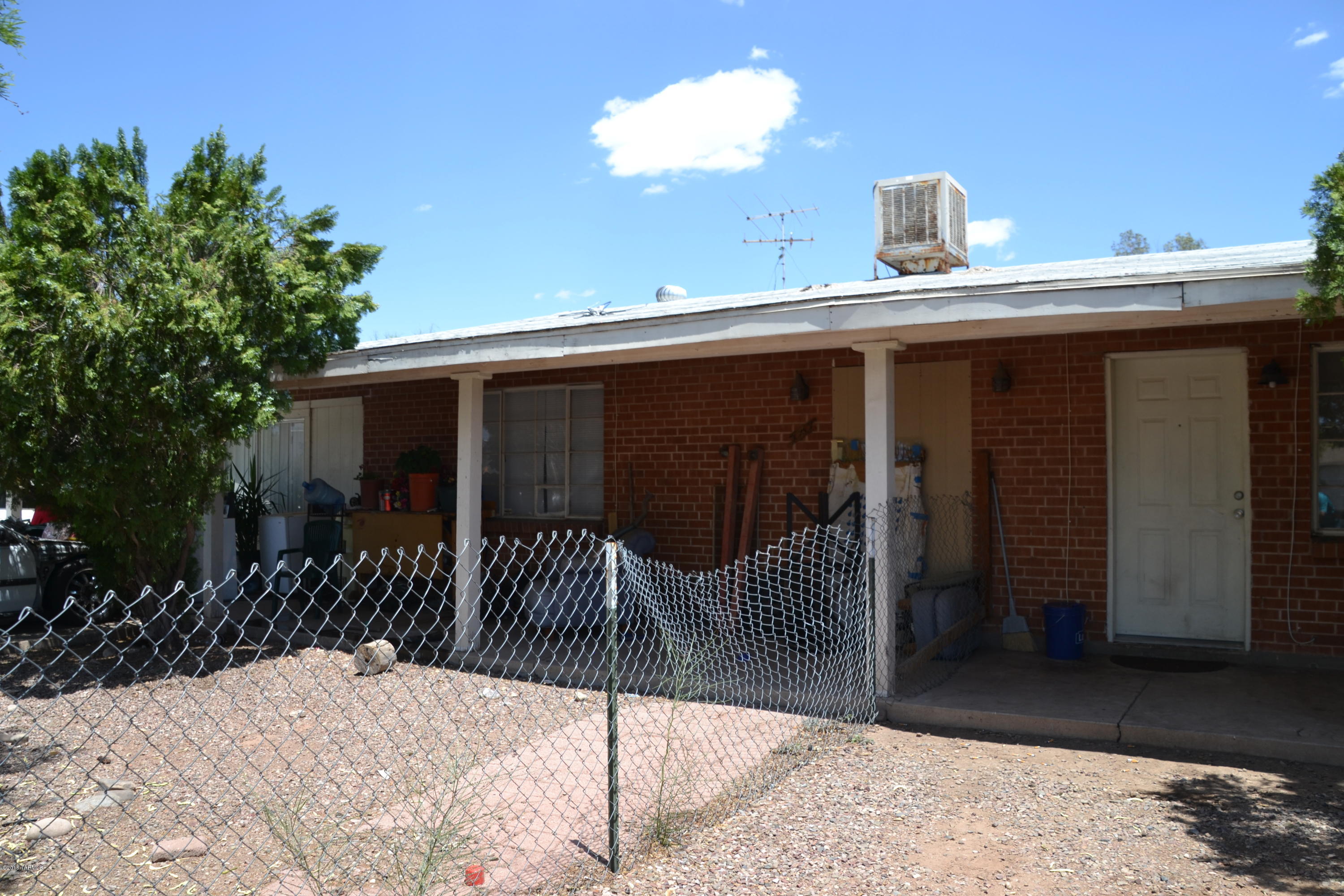 Great Opportunity Investment property. Residential Income, Duplex.(2) 2 bedroom 1 bath units. Unit A has Carport and electric heat. Unit B, fresh paint, with  large living area, open floor plan and gas heat. Large yard. Good tenants, easy to rent. Call for a showing. Utilities included in rent.Unit B with year lease. Unit A month to month (long term)
