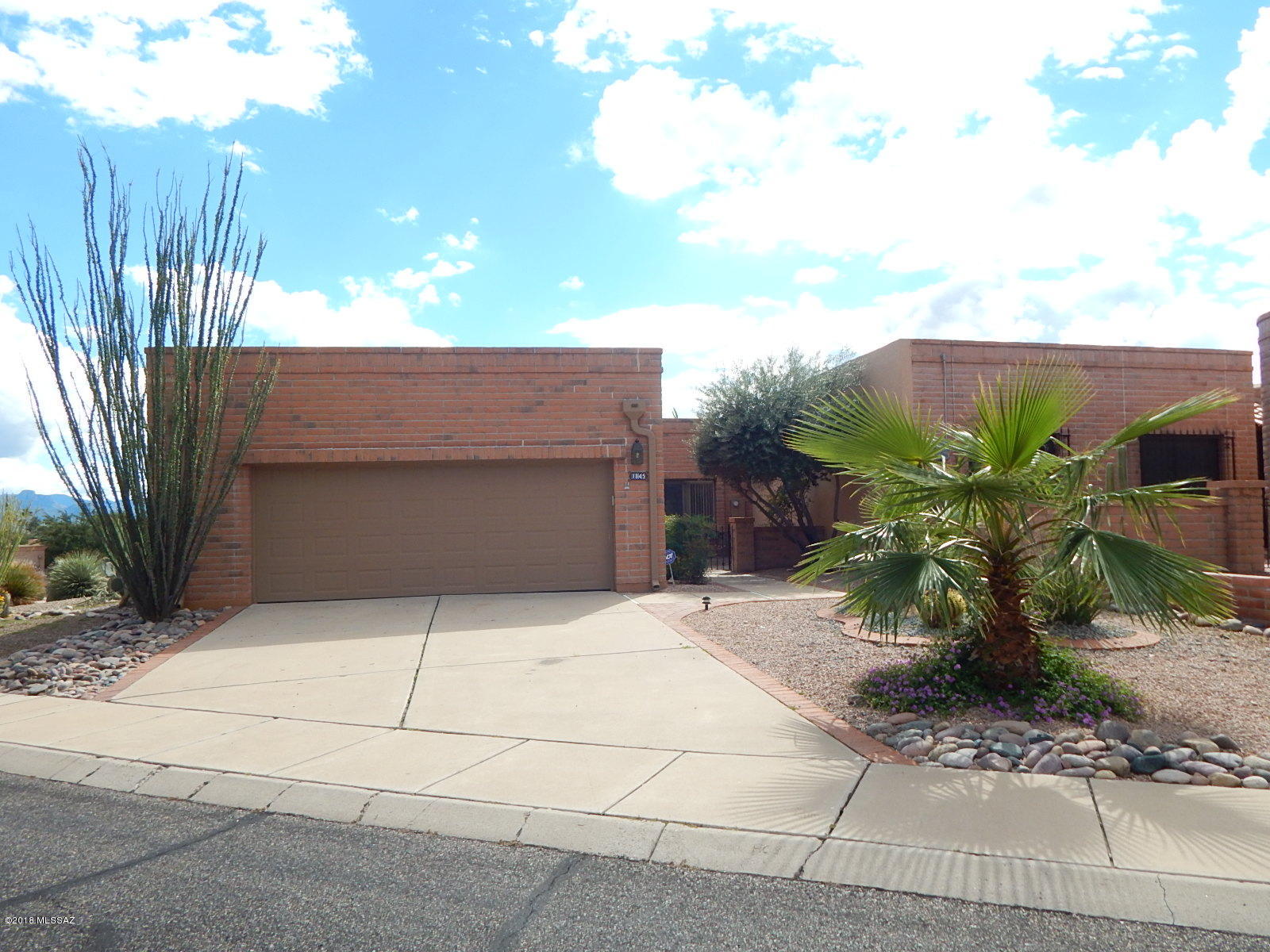 PRICE JUST REDUCED! This is a Fannie Mae HomePath property. With 1750 sq ft of living space this townhouse has 2 bedrooms, 2 bathrooms, plus den, living room with fireplace & large backyard with covered patio & beautiful mountain views. Part of Green Valley Recreation where there is always something to do. GV Rec membership provides 14 centers with pools, spas, exercise equipment, sport courts (tennis-pickleball-raquetball-basketball-shuffleboard), movies, lectures & more. <FONT COLOR=RED>Recently painted interior with two tone paint & install new stainless steel  kitchen appliances. </FONT> Located close to I-19, shopping, restaurants, and much more! Attention First Time Buyers: complete the HomePath Ready Buyer homeownership course. Attach certificate to offer and request up to 3% closing cost assistance, ask Agent for more details, restrictions apply.