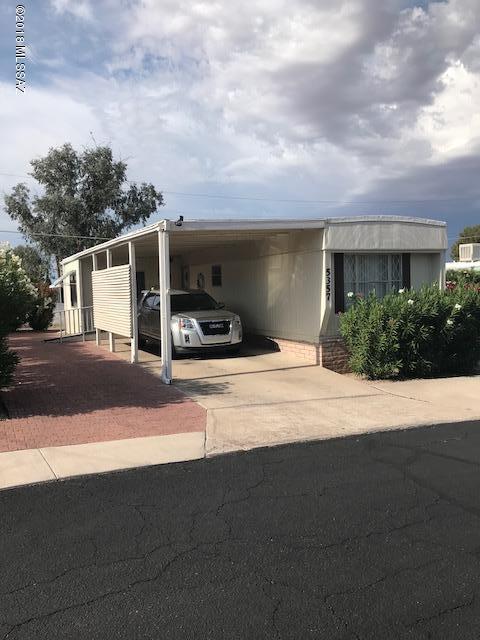 Nice single-wide with bedrooms and bathrooms on each end of the home.  Both bathrooms have walk-in showers.  Partially renovated.  Kitchen and bathrooms have newer cabinets and counter tops.  There is a bump out area for the living room.  There is a nice storage room with shelving.  Newer central AC installed.  Mostly furnished home.  .    The HOA fee includes unlimited golf, tennis, pickle ball, shuffleboard, 3 pools, spa, exercise room, trash collection, and a lot more.  You own the land!