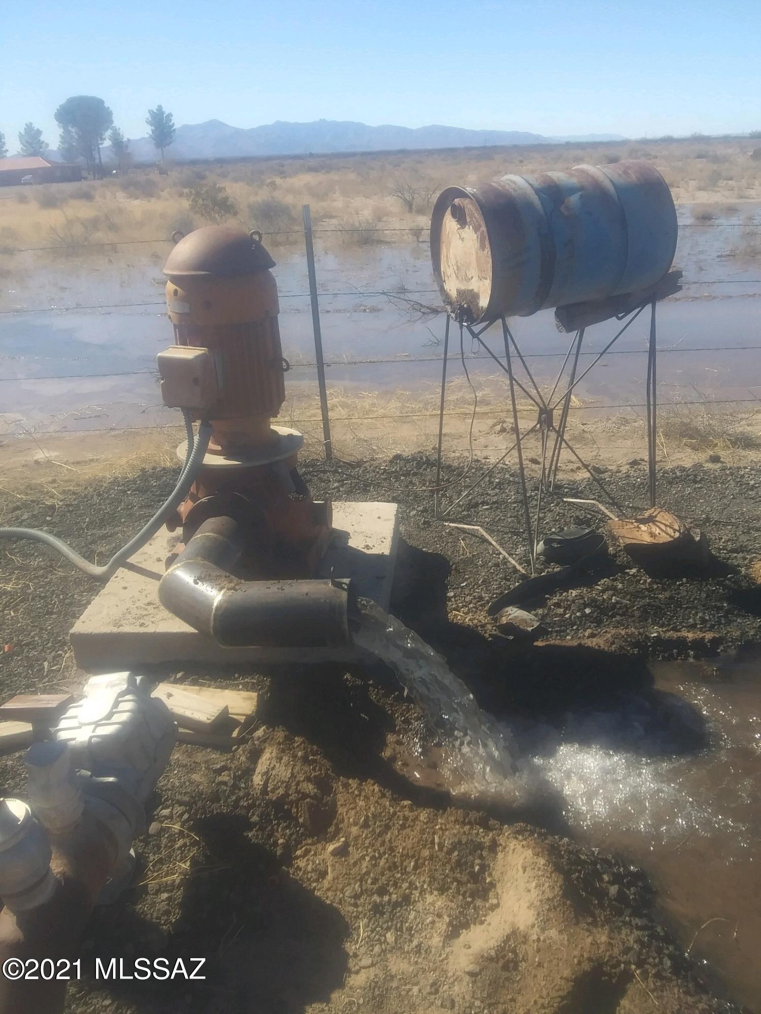 40 Acres w/well & electric in place. Well has a 10 HP pump, tested recently at 200 gpm. Plus there is 8'' irrigation pipe running on east side of the parcel from north to south w/risers. Buyer to verify functionality system has not been used in quite some time. Previously farmed for alfalfa. San Simon City water is also avail. for domestic use. 40 acres is fenced with the exception of about 600' on south side. If you are looking for self-sustaining living this is quite affordable, Acres can be divided. Easy access off of black top of Parker Rd and minutes from I-10. Chiricahua Mountains are just a short drive or horseback ride. San Simon offers a small grocery, medical clinic, gas stations & church. 35 miles to Willcox for major shopping & medical. Neighbor to the east is an established pistachio farm.