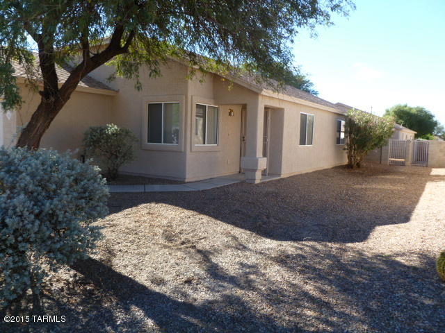 Super clean, the property shows like fresh construction with brand new carpet and a professional repaint inside and out. 4 Large bedrooms and 2 full baths make this the perfect family home.  The extended family room is great for get-togethers & parties.  The rear, covered patio provides a big secluded area for entertaining and quite relaxing.  The seller is leaving all the appliances to include the washer & dryer! This wonderful home, in a really nice neighborhood is a must see! Close to shopping, schools and Davis-Monthan Air Force Base too. --Do not miss out on this spectacular deal!