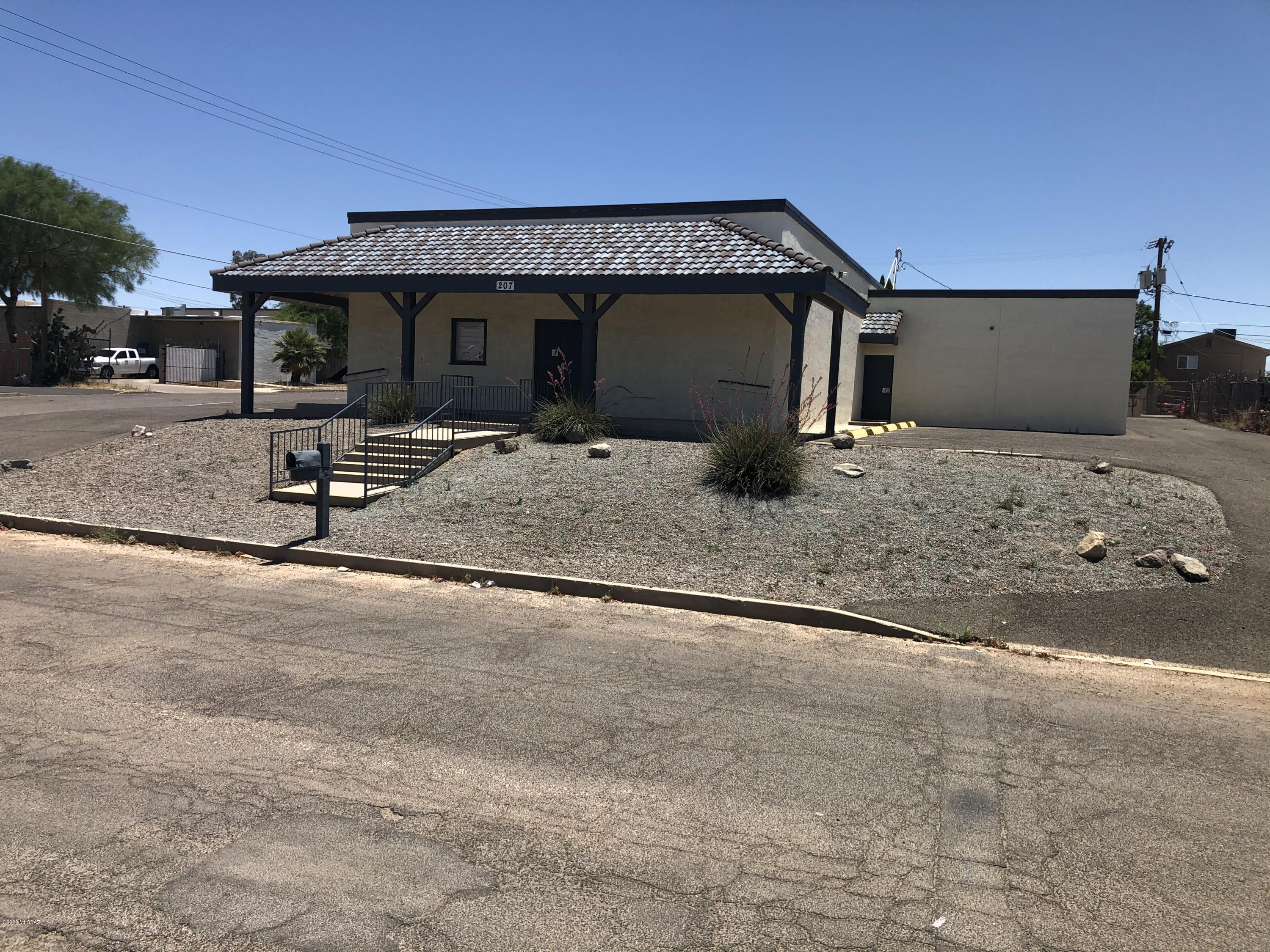 This former church facility is now available for purchase. With the addition of a fence this property could be converted to a contractors yard to utilize the 
two I-1 zoned parcels on an elevated lot. Paved parking for 30 cars. The building consists of a large meeting room with stage, a smaller meeting room, storage, and separate mens and woman's bathroom facilities. Electronic equipment, chairs, and TV's will convey with the sale. Please submit with all offers a signed copy of Addendum PSA-1, which is available from the listing agent on request. Parcel numbers are 115-06-0210 and 115-06-0220.