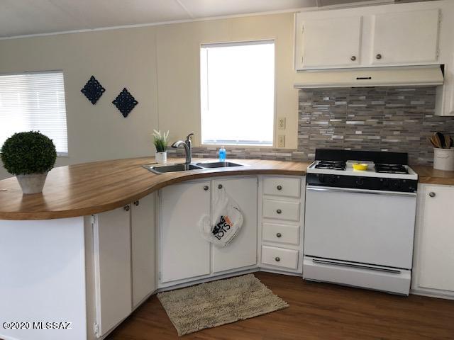 Fresh with new paint interior/exterior, new flooring throughout, 2 brand new tub/shower surrounds,  this 1+ acres features 3bdrm 2 bath, new A/C, covered porches. SH zoned allowing for 2 homes, completely fenced. Lots of room for another home and toys. Move in ready!