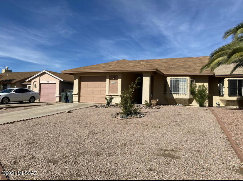 Home in Midvale Park, 2 bedrooms, 2 baths, ceramic title, Upgraded cabinets, extended patio, with a fenced backyard and one car garage. Close to Shopping, Restaurants, Schools and I-19.