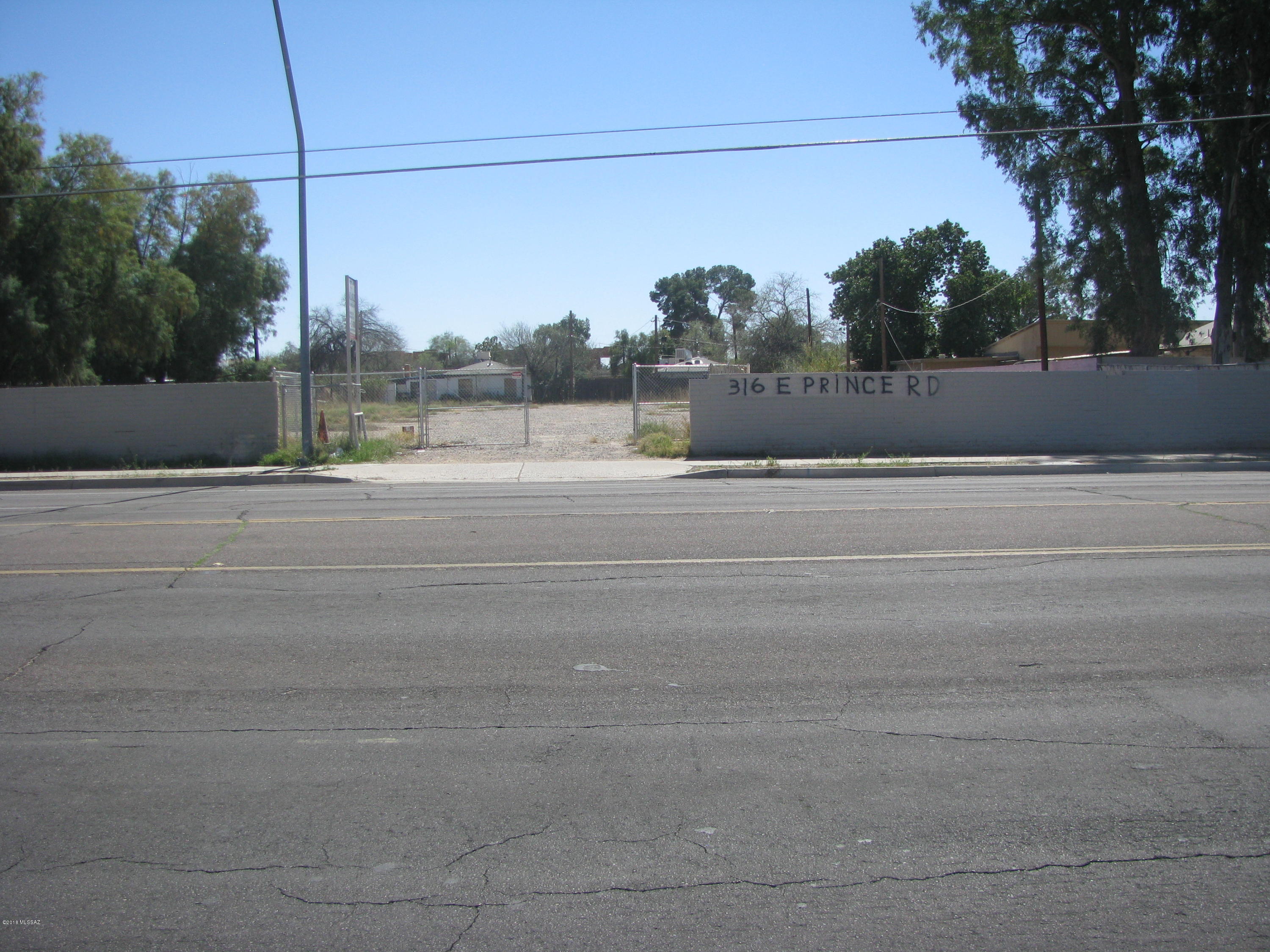High Visibility C-2 lot across the street from Amphitheater Middle School. Property is secure with fence/wall. Could be an ancillary business location for Amphitheater services, a drive through fast food or other C-2 uses. Property was formerly a mobile home park.