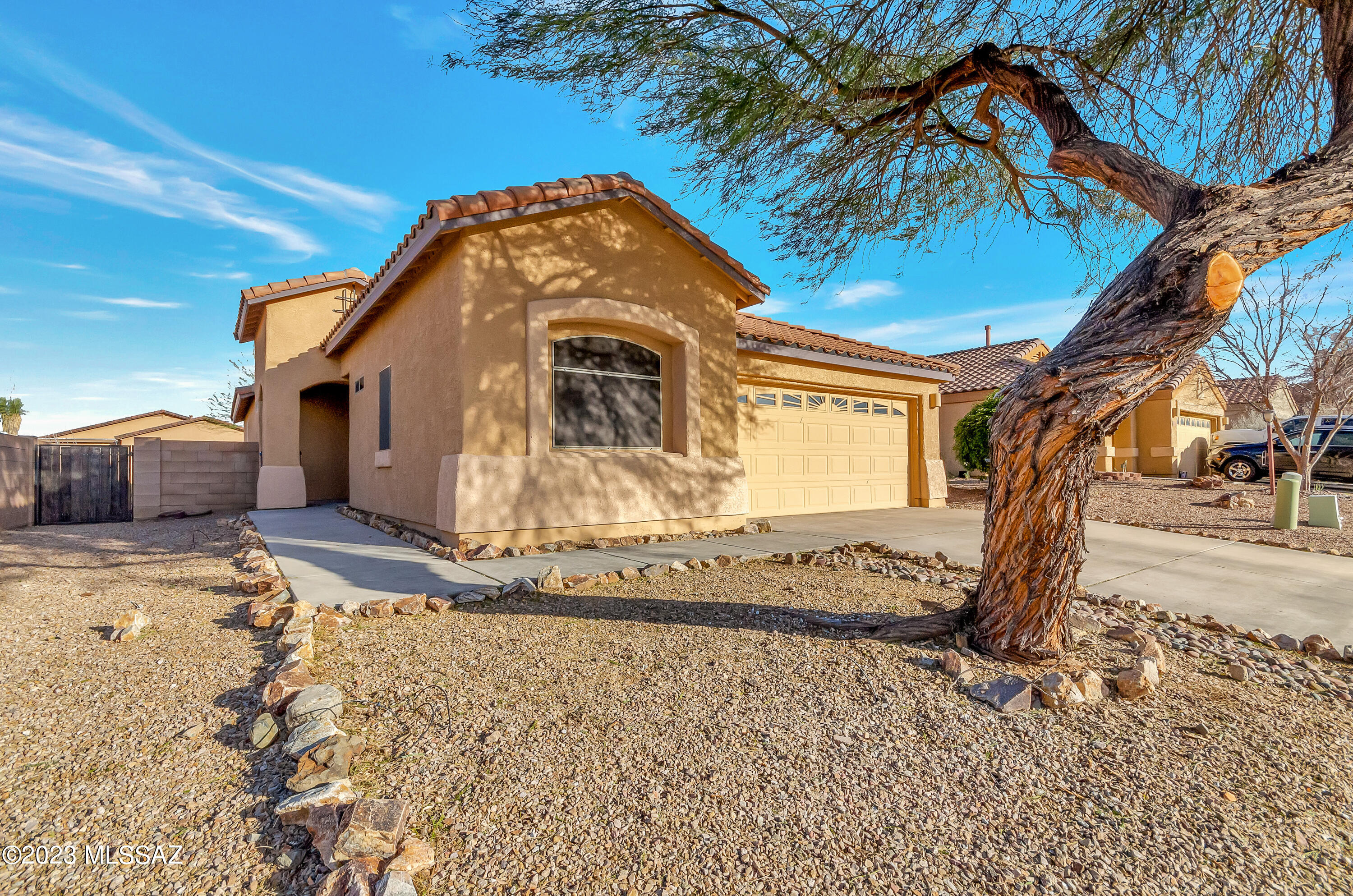 This Vail school district home in Corona de Tucson has been lovingly maintained and has a wonderful open great room with high ceilings & plant shelves. The kitchen features a two-level center island/breakfast bar & a multitude of drawers & cabinets, including pull out shelves in the lower cabinets, and a large walk-in pantry. So much storage! The living area is light and bright, w/ access to the cvrd patio & room for all your furniture. The large owner's suite is separate from the other 2 bedrms. Check out the custom faux wood window coverings! There is a nice cvrd patio for your BBQ and a clean yard awaiting your personal touch This 3 bed 2 bath home has a 2-car garage, is located on a cul de sac and includes ALL appliances. Totally MOVE IN READY! See it today!
