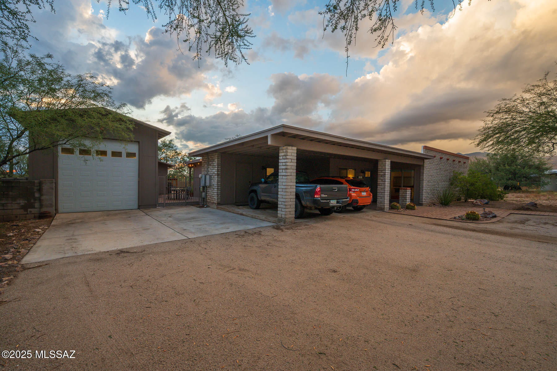 Beautiful 4 Bdr/3 bath home in the Tanque Verde Valley w/ updates throughout! Check out the Features List under Documents tab. 2206 sqft with an additional 288 sqft in a heated and cooled bonus/studio room located in detached garage. Spacious, bright, remodeled kitchen with island, quartz counters, stainless steel appliances, double oven, and abundant cabinet space. Opens to large family room with wood-burning fireplace. Separate living and dining rooms. Primary features updated tiled shower and vanity. Ceramic wood-look tile throughout, carpet in 2 bedrooms and living room. Gorgeous large private backyard with saltwater pool and mature trees. 2-car carport plus oversized tandem garage with workshop, full bath, and bonus room with additional soundproof room.  HVAC new in 2024.