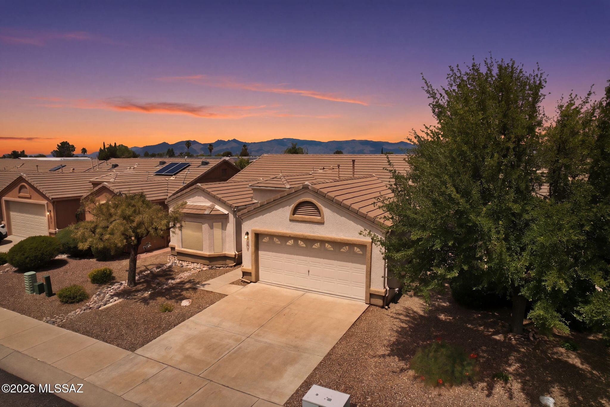 Welcome to this fully furnished home in the sought-after ''Voyager'' 55+, gated community. This meticulously maintained home was the ''model'' & offers a rare floor plan with kitchen and dining at the front of the house, benefitting from natural light, just off the foyer. With 2 spacious BRs & 2 full BAs there is extra space in the living areas, perfect for family or for entertaining by the rare fireplace. Most systems have been updated in recent years: newer roof, HVAC, H2O heater, soft H2O conditioner, & appliances. Only 1 owner has occupied this home & has lovingly cared for every aspect. The 2-car garage has floor to ceiling built-in cabinets, lots of room for tools/storage. Furnishings and golf membership convey! A turnkey opportunity for the next owner of this special property!