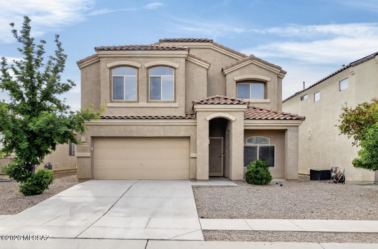 Come see this amazing 4 bed 3 bath home located in Caddis Haley Estates in Southwest Tucson just past Casino Del Sol situated on a just under a 5 thousand sqft lot featuring 2,596 sqft with new carpet installed and new tile downstairs, tile upstairs and in all wet ares of the home, stainless steel appliances, security doors on front and back doors, overhead storage in the 2 car garage. Modern lighting fixtures 2' faux window blinds on all windows, tile roof, only a $35 monthly HOA, under stair storage, and plenty of space for the entire family! Parks in the community and an easy 10 minute drive to the spectrum shopping centers and I-19 come see it today!