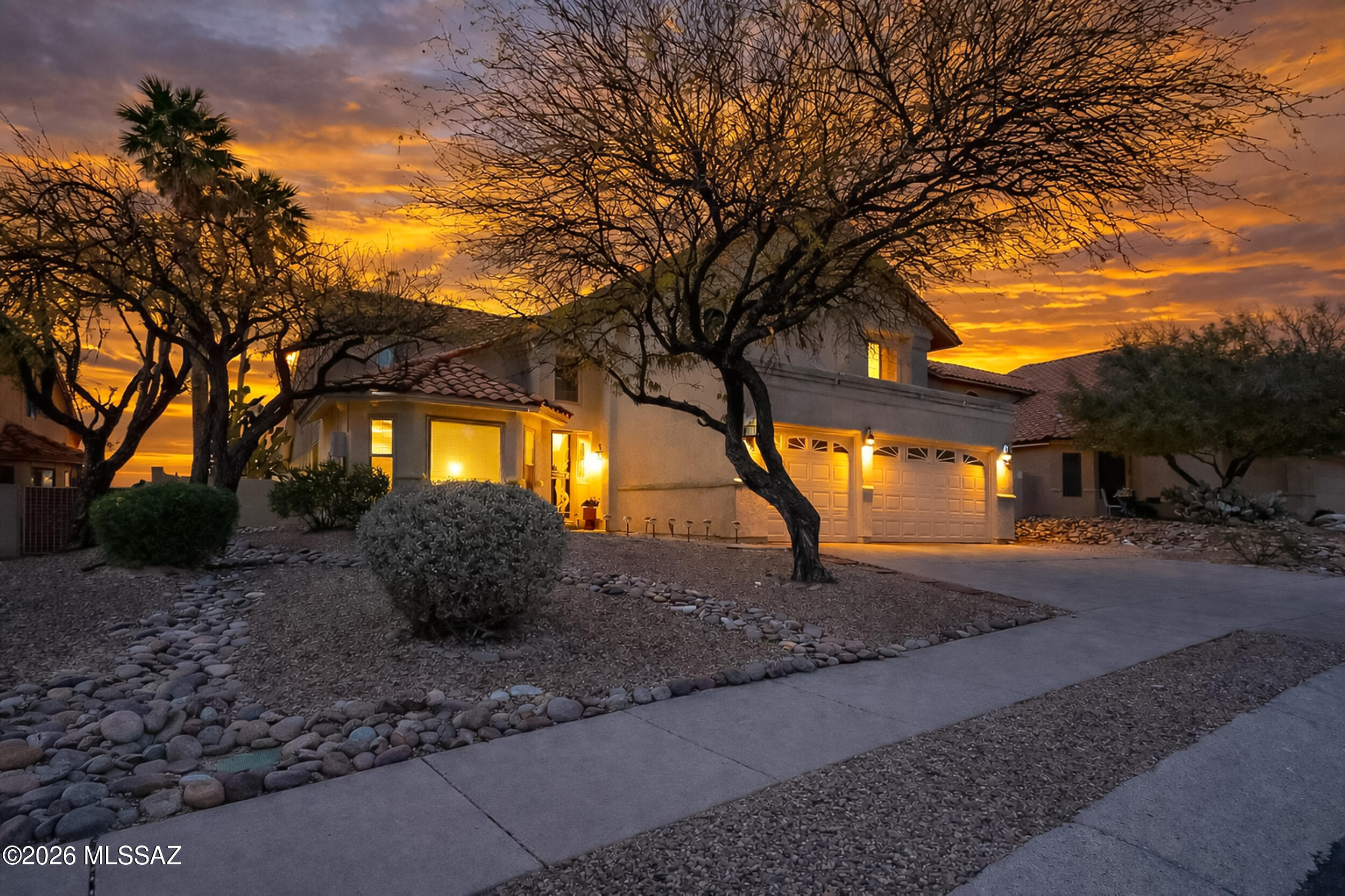 Welcome this beautifully updated home in the Copper Creek neighborhood. Offering 2,966 square feet of living space, this residence features five spacious bedrooms and two and a half bathrooms, providing plenty of room for family and guests. The expansive primary suite is conveniently located on the main floor and boasts three closets for exceptional storage. The kitchen and bathrooms have been tastefully upgraded with new quartz countertops and freshly refinished cabinets, creating a modern and elegant feel throughout. Step outside to your private backyard oasis with no neighbors behind you, where you can enjoy breathtaking Arizona sunsets while relaxing by the sparkling pool or playing on the sports court. The exterior was freshly painted in 2024, giving the home a crisp, updated look. Additional peace of mind comes with the absence of polybutylene pipes, and assistance with rate buy-down and closing costs is available with a strong offer. Seller is a lender. This home is move-in ready and perfectly situated in one of Oro Valley's most desirable neighborhood. Don't miss your chance to make it yours! Use our preferred lender and receive up to 1.75% lender credit to use towards a rate buy down or closing cost credit. Contingent upon loan approval.