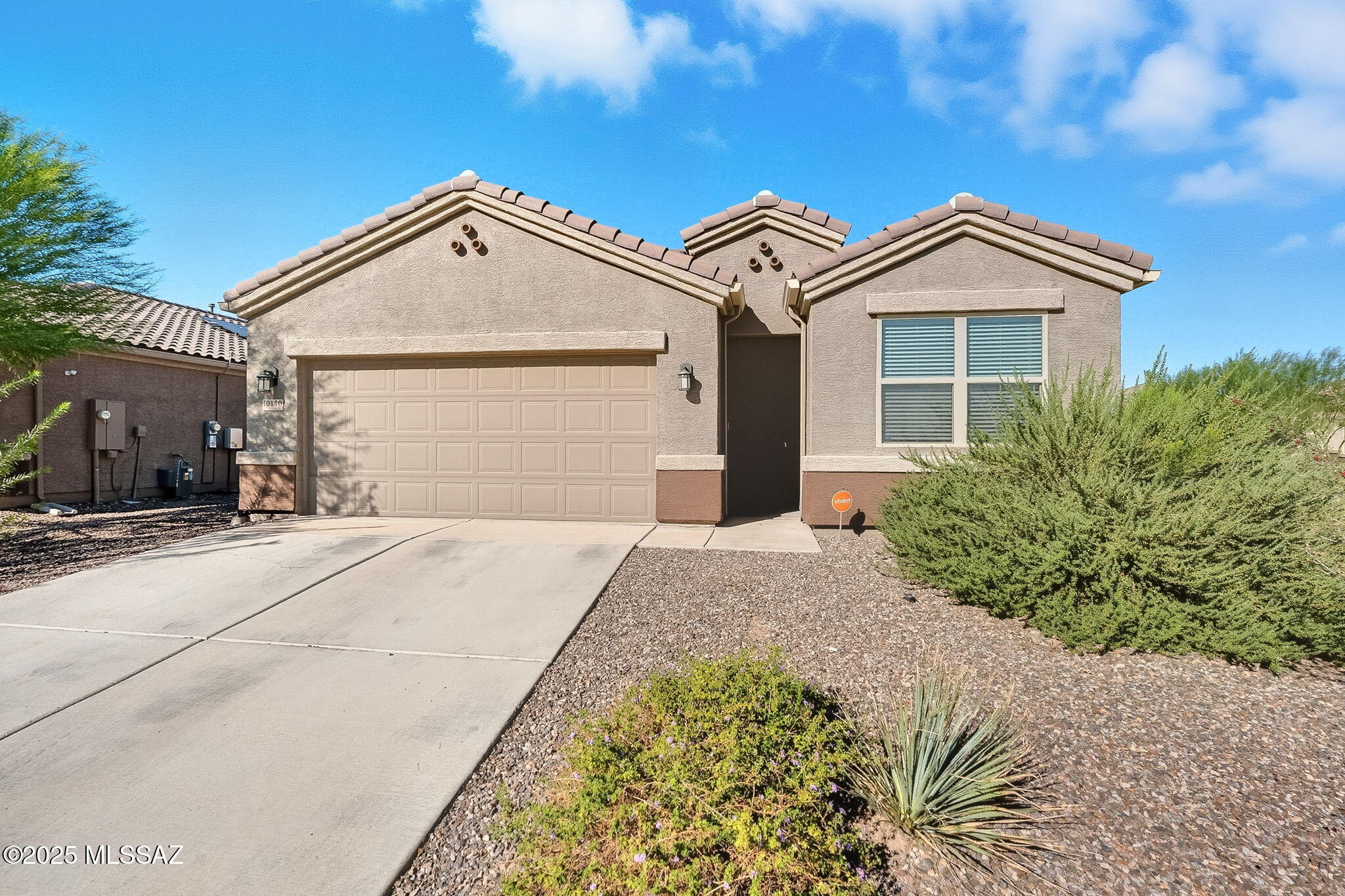 Great 4 bedroom / 2 bath contemporary home tucked back in the wonderful neighborhood of Saguaro Bloom. Home features kitchen with large island, pantry, stainless appliances and plenty of cabinet space. Kitchen opens to dining area and great room. Primary bedroom is extra spacious with huge walk-in closet, dual sinks and shower. 9' ceilings and tile flooring. Fully fence backyard with covered patio.  Two car garage and easy care landscaping. Tankless water heater.  Home was built in 2022 and feels brand new! Owned solar system.  Washer, dryer and refrigerator included.