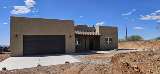 Spectacular Santa Fe Style home with breathtaking mountain views! Open floor plan with beautiful light tan self closing cabinets, Phoenix Gold color quartz countertops matching the cabinets and flooring. Three bedrooms and two full baths with gorgeous selected tile and quartz on bathroom countertops. Enjoy the convenience of interior laundry room.
