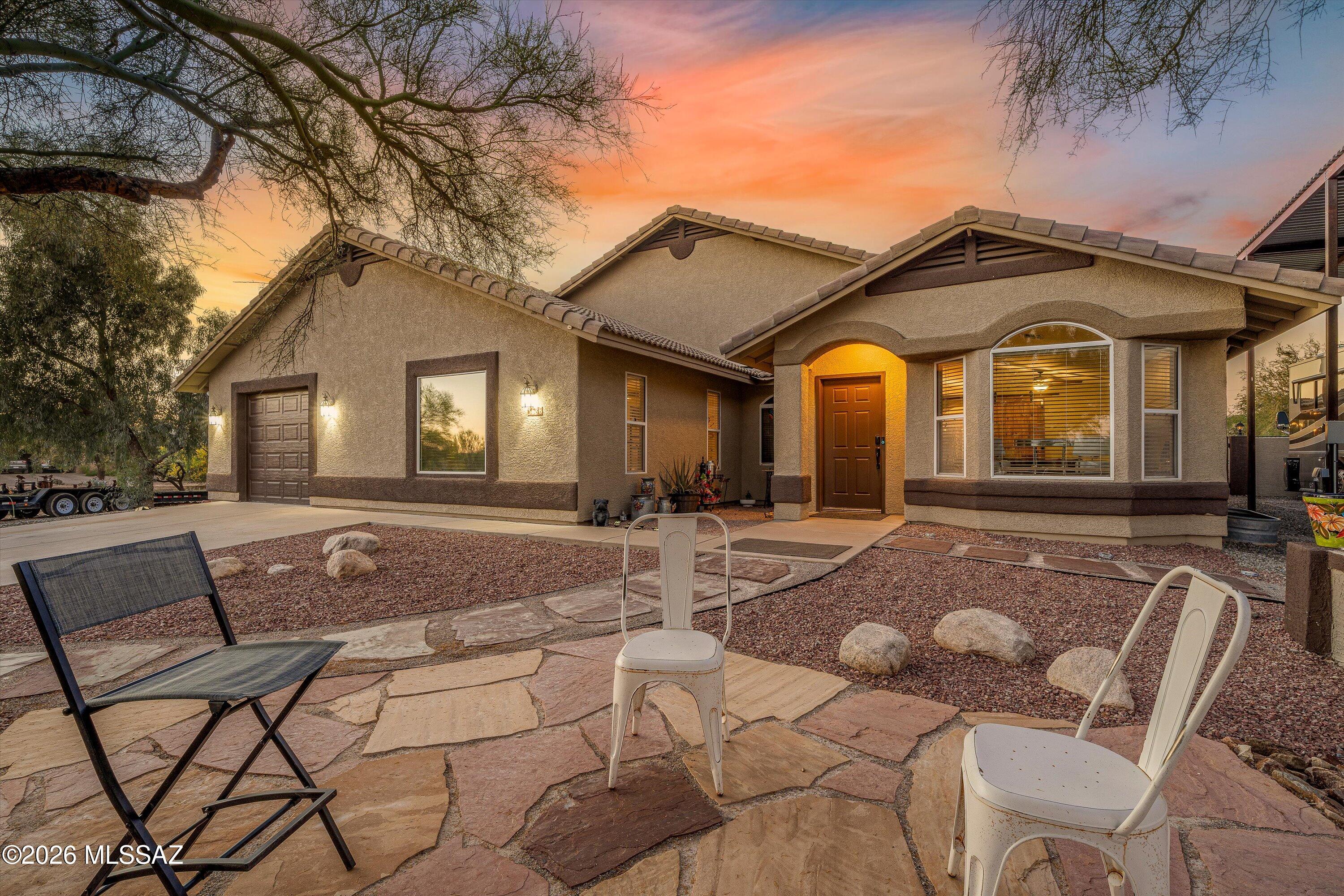 Wonderful Northwest Tucson home on a spacious one-acre lot! This 2,270 sq. ft. single-story home features 3 bedrooms, plus an office and 2 full bathrooms with a flexible floor plan designed for comfortable living and entertaining! No carpet, and new flooring! The expansive kitchen offers a breakfast bar and cozy breakfast nook. Step outside to your private backyard retreat with a completely updated refreshing pool and expansive open space with a 30 x 50 RV parking structure, a 30 x 40 car enthusiast dream garage/workshop! Experience the freedom of wide-open desert living with beautiful views while remaining just minutes from shopping, dining, and everyday conveniences. See the list of updates!