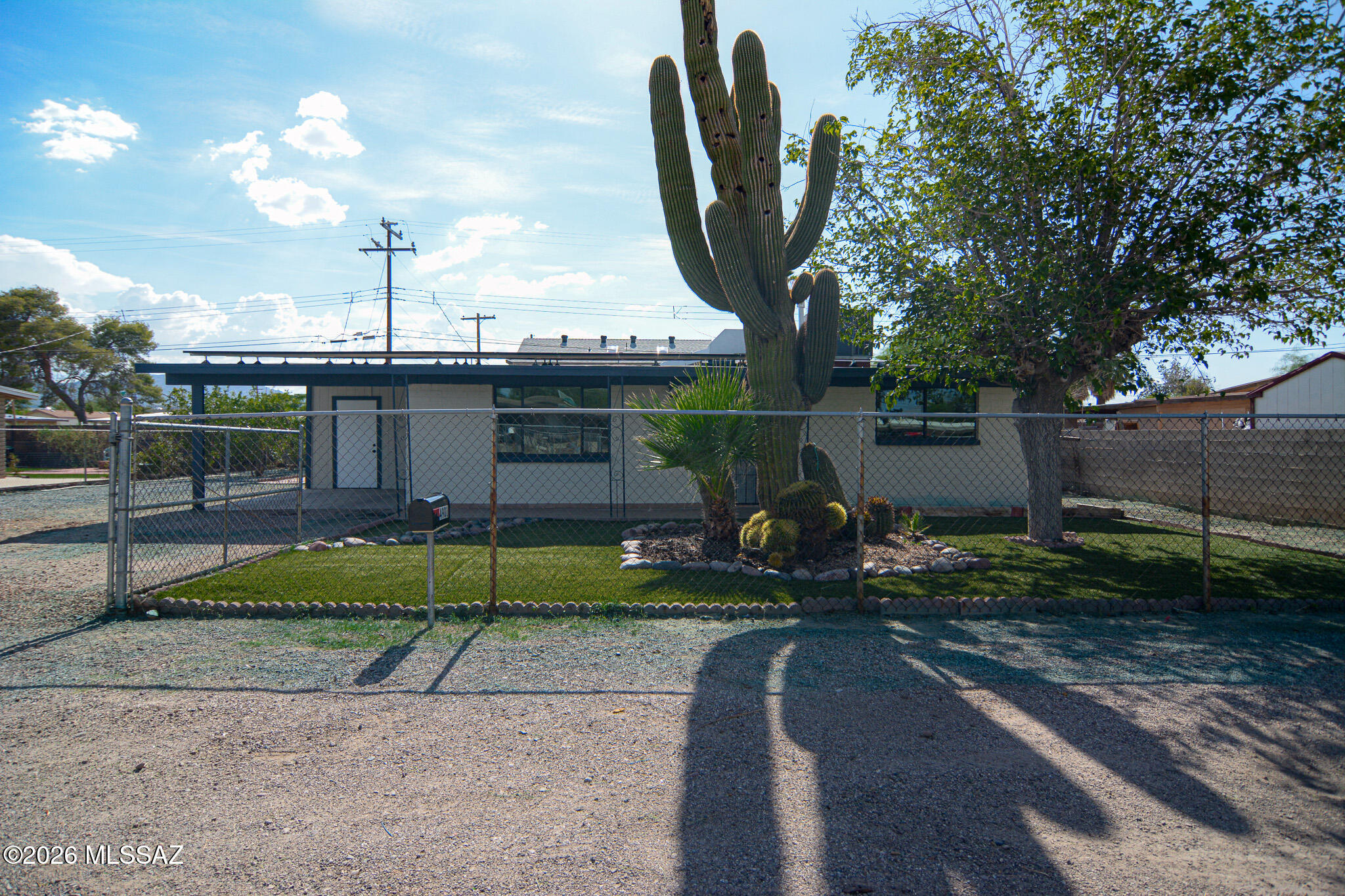 Beautifully remodeled Ranch style home. Located in a convenient Northwest Tucson location. Minutes from the I-10. Charming block construction. Rich earth tone ceramic tile. Updated kitchen with stainless steel appliances. New custom interior and exterior paint. Updated bathrooms. Ceiling fans in two bedrooms. Fenced yard. Mature tree and cacti. Upgraded door hardware and light fixtures. New dual pane windows. One car carport. No HOA. This home shows beautifully.