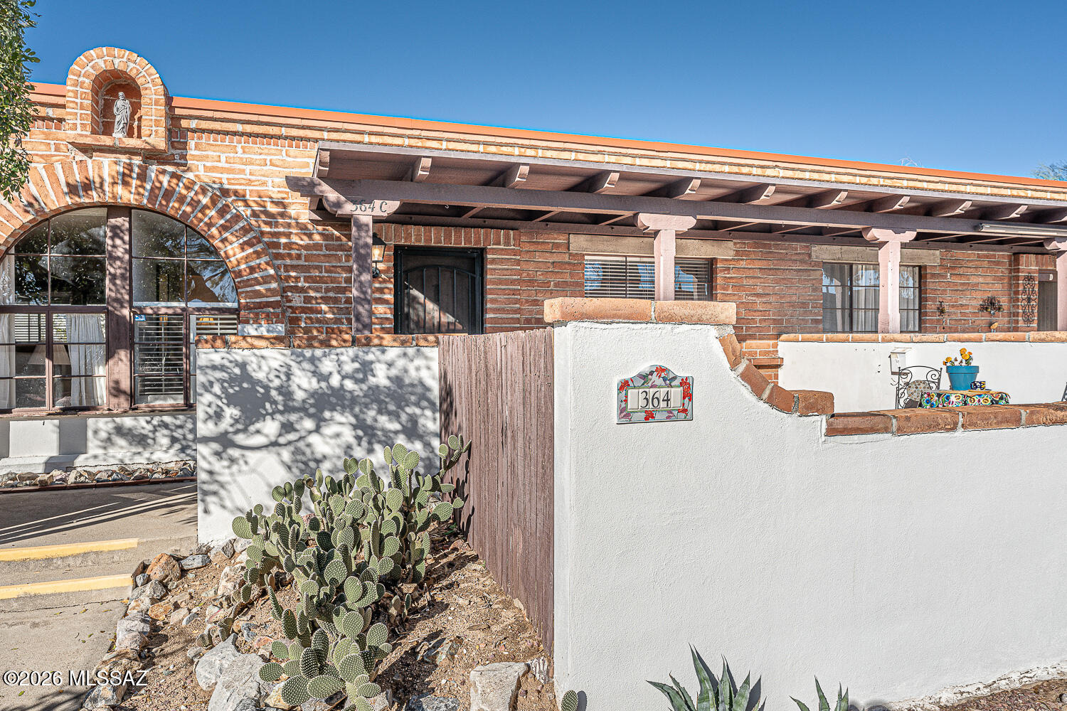Great location, set back with park in front to the east and mountain views!    Behind is parking, so just a short walk into your kitchen with your groceries!  The community laundry is just out the back door,  with clothes lines where your clothes dry fast and fresh!   Just steps to the pool to the south or the Green Valley Mall to the north, where you can enjoy the Wednesday markets!    This home is sparkling clean and ready for your personal touches!   New laminate floors plus tile in all the right places!    New bed conveys and a few pieces of furniture and personal property.   Come see this gem and make it yours! No GVR, however available!