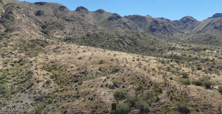 High county views above it all in East Rio Rico could be yours! Rare find in Santa Cruz county with 18.62 acres, no HOA, at the base of Mt. San Cayetano, east side of road to the mountain. You can build your custom home at this special location, yet only a few miles to the freeway, schools and shopping. Enjoy spectacular sunsets like none other, only in Rio Rico.