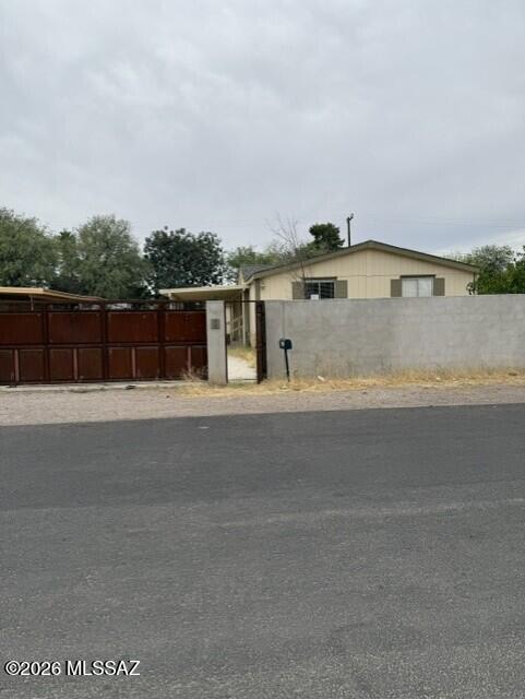 This is a charming 3 bedrooms 2 bath home, recent remodeling has been completed in the kitchen and living areas.  Home has laminate flooring throughout, granite countertops in the kitchen and new cabinets.  Home also has a newer HVAC system and has a shed with a mini spit for cooling and heating.  Home also has a covered patio off the dining area for relaxing outside.  Home has a high wall all around and a automatic metal gate for access to the carport and the front door for your security.