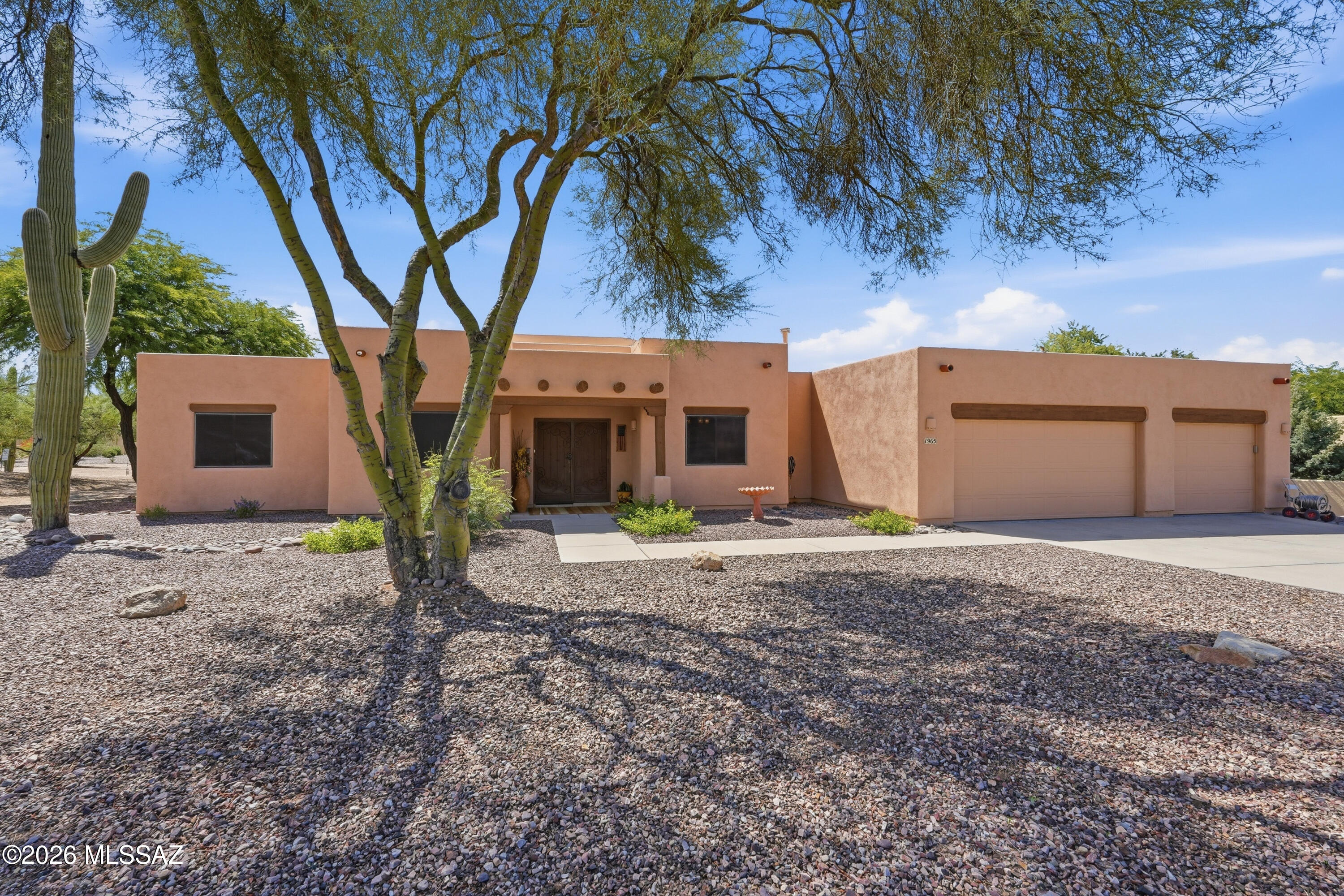 Embrace the perfect combination of spacious suburban privacy and unbeatable everyday convenience in this beautifully positioned Oro Valley retreat. This home offers 3BD/3BA+Den/Office+3 Car Garage (2,163 sqft) of bright, functional living space. This contemporary residence opens into an airy, light-filled footprint with a neutral color palette. It is a magnificent match for anyone looking for an established neighborhood vibe. At the center of the home is a spacious open great room that flows effortlessly into the main living zones. A cozy focal-point fireplace anchors the primary living room, creating a warm ambiance for cool desert evenings. For hosting gatherings, the home uniquely presents a flexible balance of dining space, featuring both a casual breakfast nook for daily mornings and a dedicated formal dining room for special occasions. The highly desirable floor plan offers three full bedrooms and three full bathrooms. This includes a private primary sanctuary and a separate, independent den that serves perfectly as a custom home office, media lounge, or study area. The interior transitions smoothly out to a spectacular, spacious lot. This expansive backyard oasis borders serene natural desert buffers, offering an immense sense of personal privacy and space. Spend quiet afternoons under the deep covered patio or create a customized outdoor retreat under Oro Valley's expansive big skies. Location is one of this property's finest highlights. Complete with a rare and highly coveted 3-car garage, you are just blocks from premier local paths and neighborhood recreation. The residence awards you immediate access to highly rated local campuses like Richard B. Wilson K-8 School and Ironwood Ridge High School. Plus, you are just minutes away from weekend festivities at Steam Pump Ranch, shopping plazas along La Cañada Drive.