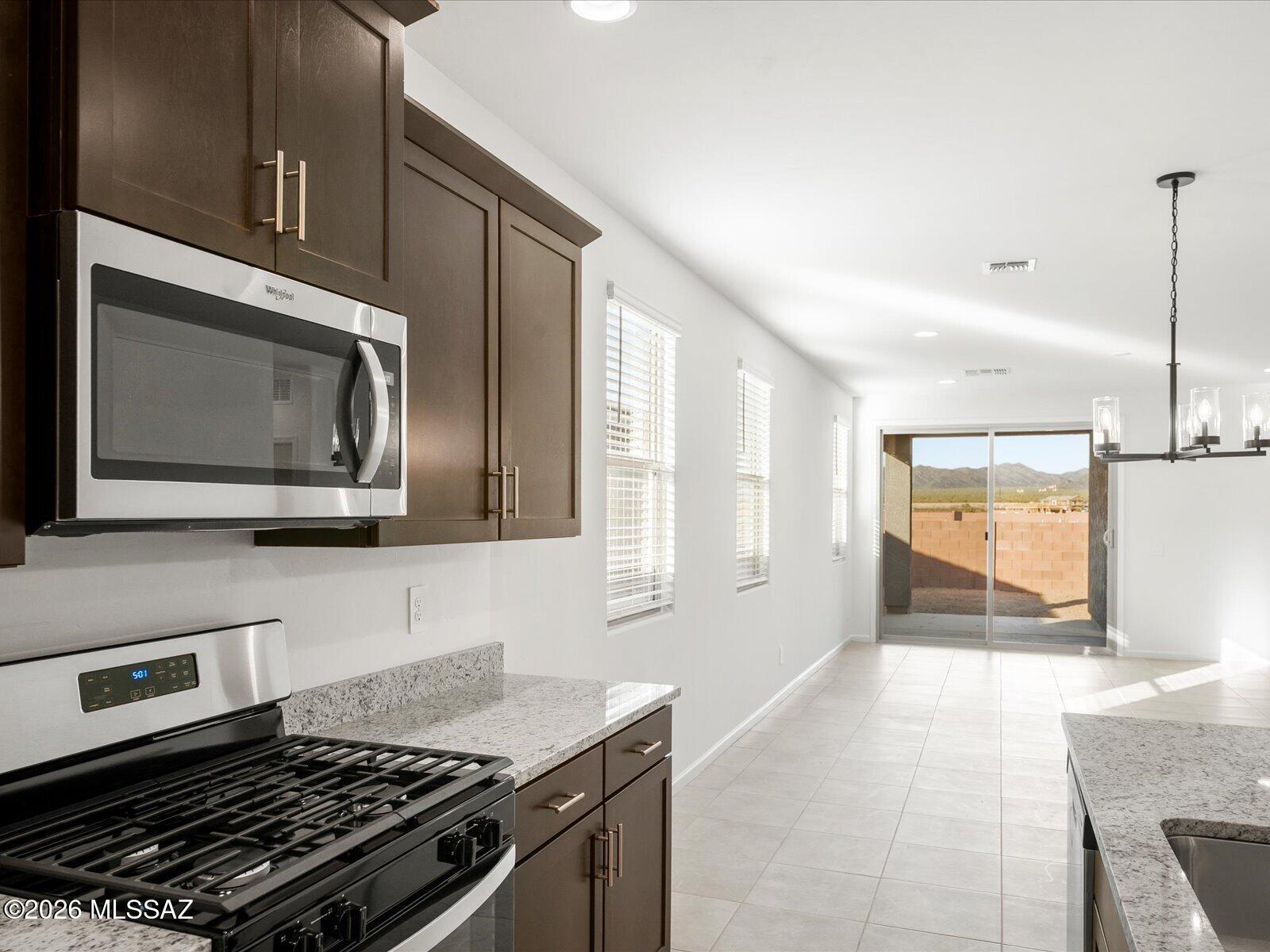 This 4-bedroom, 3-bath home offers a dream layout designed for effortless entertaining. A versatile teen room provides the perfect secondary living space for homework, movie nights, or gaming. The spacious primary suite features dual sinks and a walk-in closet for added comfort and convenience.
Located in the sought-after Mandarina community in Marana, AZ, residents will enjoy a thoughtfully planned neighborhood with resort-style amenities, including a swimming pool, pickleball courts, playgrounds, a dog park, and more.
This move-in-ready home comes complete with a washer, dryer, refrigerator, and whole-home blinds. Built with innovative, energy-efficient features, every home is designed to deliver greater savings, improved comfort, better health, and lasting peace of mind.