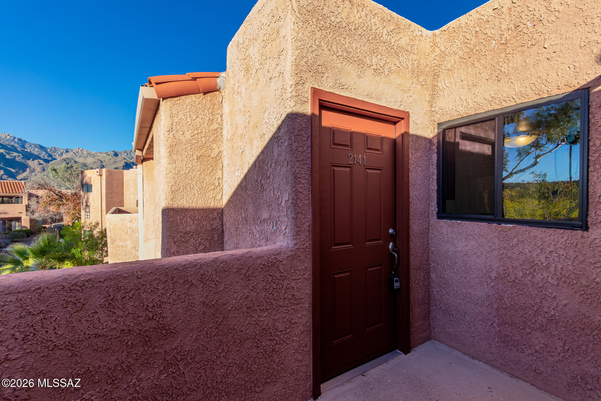 Move-in ready 2BD/1BA condo offering approx. 976 sq ft in a gated, resort-style community near Sabino Canyon. Features include fresh interior paint, new carpet, new door locks, a wood-burning fireplace, and a private balcony with mountain views. Spacious bedrooms with generous closet space and covered carport parking included. Community amenities include heated pool and spa, clubhouse, fitness center, tennis and pickleball courts, BBQ areas, walking paths, EV charging stations, and on-site management. HOA includes water and trash. Conveniently located near shopping, dining, and outdoor recreation. Agent/Owner