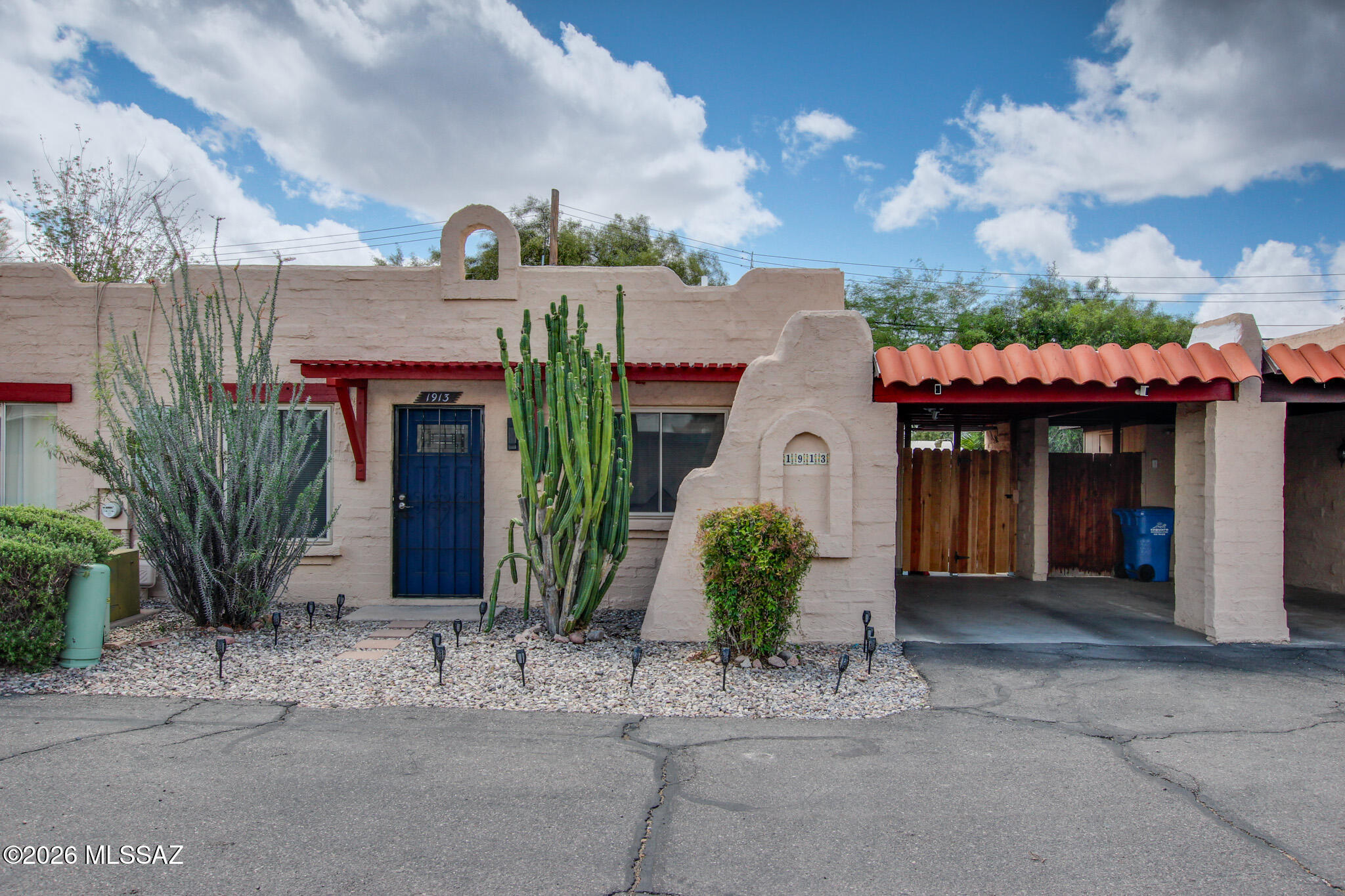Beautifully updated 2-bedroom, 1-bath townhome in central Tucson showcasing modern finishes and move-in-ready appeal. Enjoy two spacious bedrooms with ample closet space and engineered wood plank flooring throughout - no carpet. The stylish kitchen has been upgraded with granite countertops and stainless steel appliances. The primary bedroom features a sliding glass door opening to a covered back patio for easy indoor-outdoor living. Ideally located near shopping, dining, and entertainment. Community amenities include a refreshing pool for those Arizona sunny days.