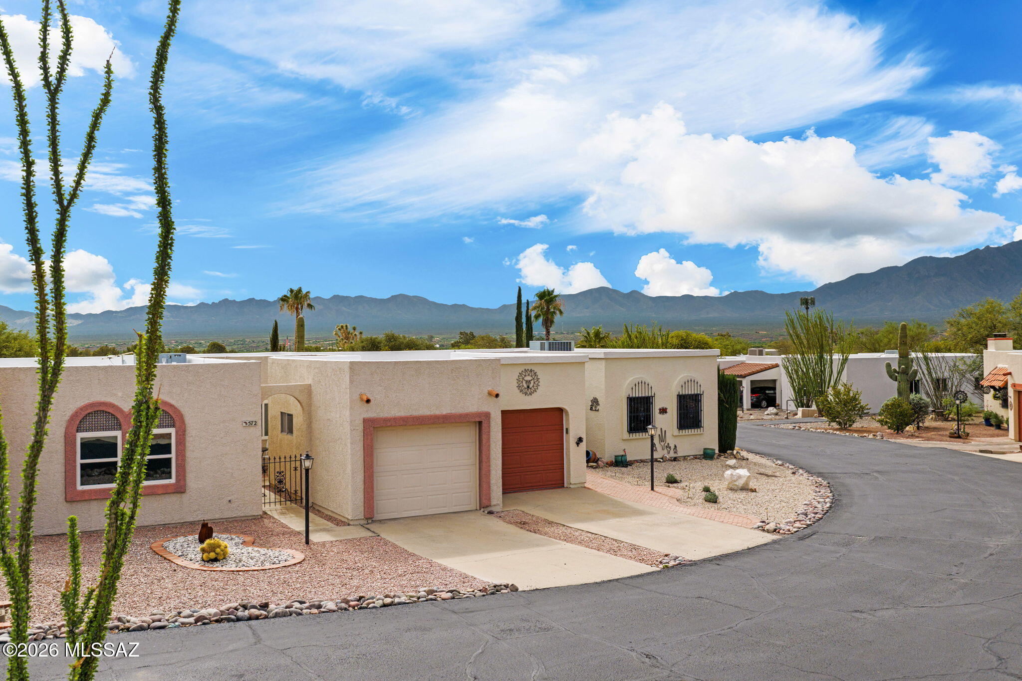Range Priced-Seller will accept/or counter offers b/w $249,000 & $269,000. Enjoy breathtaking views of the Santa Catalina Mountains and unforgettable Arizona sunsets from this beautifully updated townhome. The spacious layout features large bedrooms, updated bathrooms, and a modern kitchen with new cabinetry & counters, custom backsplash, breakfast bar, and newer appliances. The inviting living spaces flow seamlessly to the outdoors, where the backyard patio & extra screened-in patio create perfect spots for relaxing or entertaining against a stunning mountain backdrop. Additional outdoor storage rooms provide space & convenience for your bicycles, hobby items & knick-knacks! Newer laminate flooring & ceiling fans throughout really make this home move in ready! Visit today & fall-in-love! Green Valley, Arizona, located just 20 miles south of Tucson, is renowned as a premier, active adult retirement community. It borders the Santa Rita Mountains, making it a world-famous hotspot for hiking and birding (especially in Madera Canyon).

Green Valley is anchored by Green Valley Recreation (GVR) which grants residents access to 13 modern, recreation facilities. Members enjoy access to 13 heated swimming pools, 6 state-of-the-art fitness centers, tennis and pickleball courts, and more than 10 specialized hobby and arts studios.