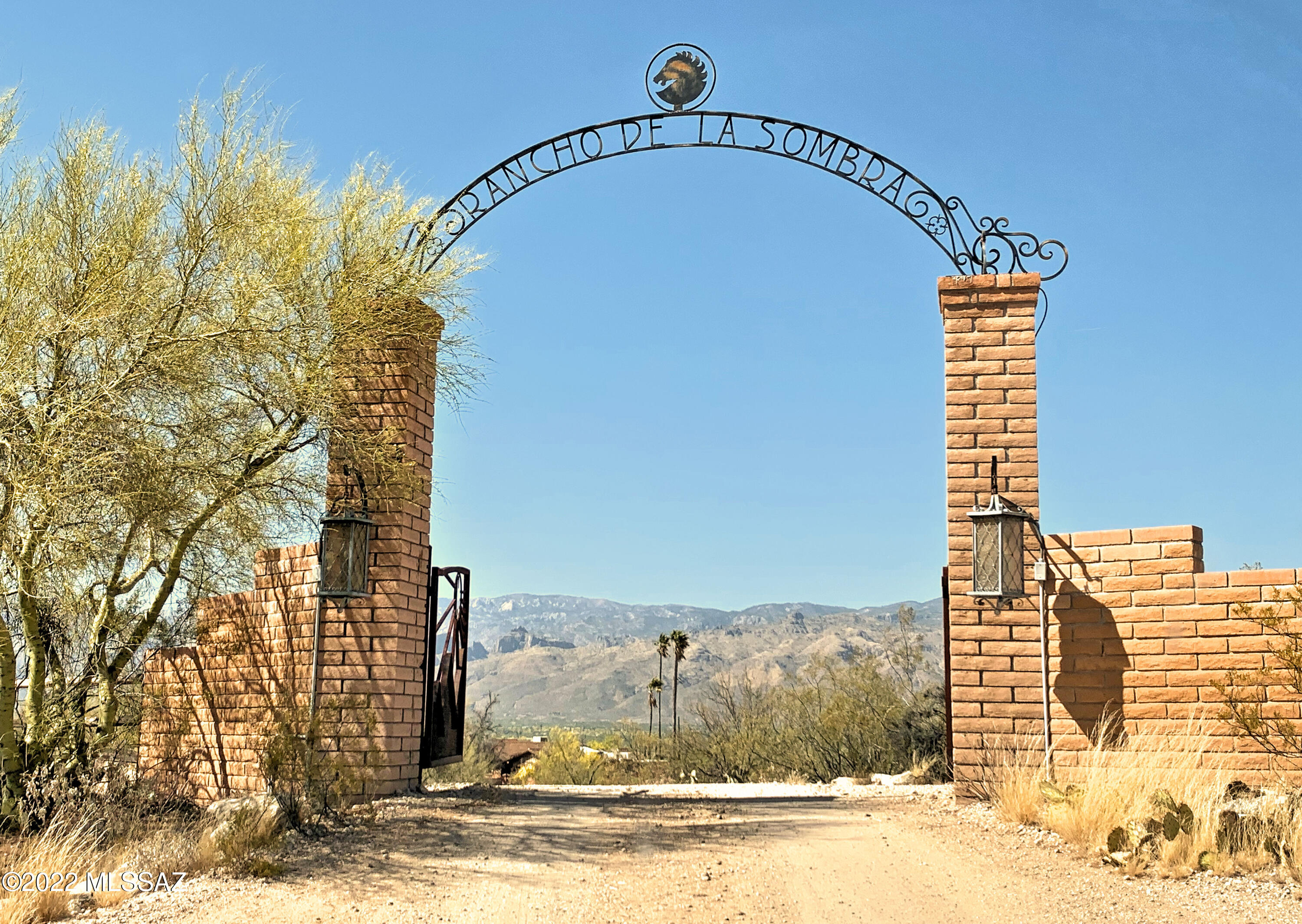 Rancho De La Sombra. 28.162 ACRES per survey! Rare opportunity to own an entire corner at Broadway/Tanque Verde Loop! Mid-Century Modern, Burnt Adobe Ranch. Family ownership for over 50 years. Once a grand equestrian estate, now ready for the vision of new ownership. Lodge Style Architecture - heavy beams, wall of windows- perched atop a gentle hill. VAST MOUNTAIN VIEWS! Banquet room for huge gatherings opens to a family/media rm. Granite slab, custom kitchen w/island & Sub Zero fridge. Original hand wrought hardware & solid doors are blended w/modern elements incl: Travertine & Rojo style concrete flooring, recent baths, Pella windows. The land is gently rolling, highly useful & sports stunning views from all corners! City water plus 2 capped water wells. This estate is offered as-is.