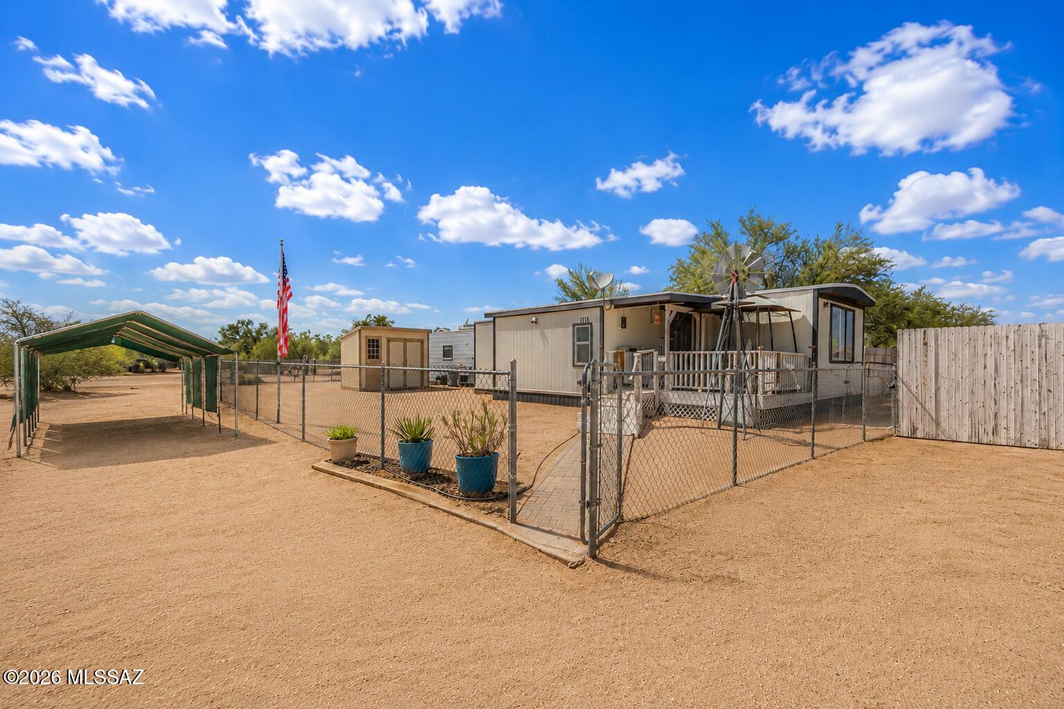 Enjoy the freedom of country living at 12110 N Placita Gravilla! This 3-bedroom, 2-bath home sits on a fully fenced 1-acre lot with plenty of room for RVs, trailers, toys, animals, or future expansion. Stay comfortable year-round with both central A/C and an additional mini-split system. The property also features a new storage shed, covered patio, and spacious outdoor areas perfect for enjoying Arizona's beautiful weather. With privacy, usable land, and endless possibilities, this property offers the space and flexibility you've been looking for.