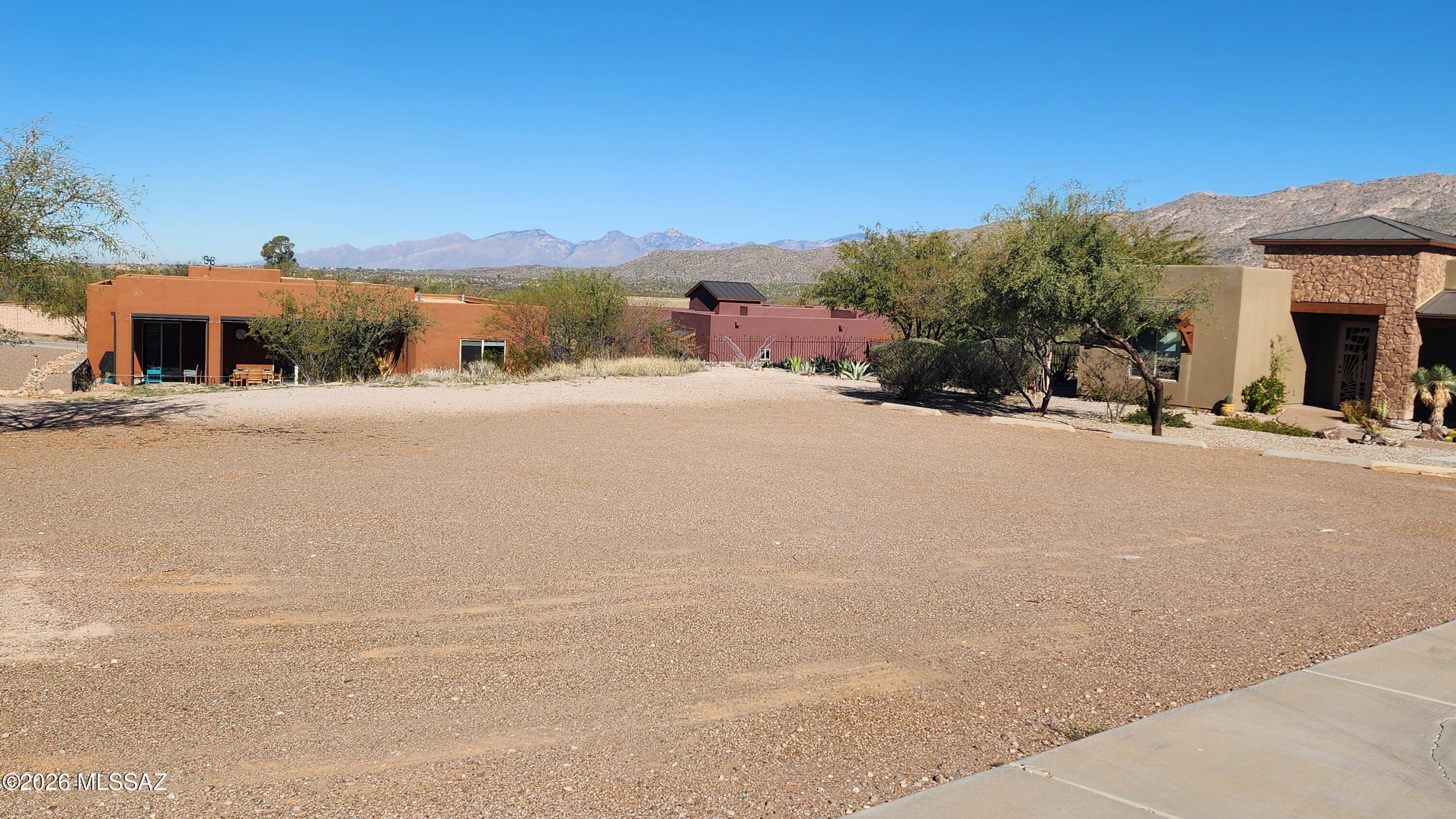 One of the best remaining lots in the community with north facing mountain views. This elevated lot was the former model home parking lot and has utilities at the street.  O'Keefe Ct is highly desirable and is a Cul-De-Sac.  Public Report available.  This is a 55+ community and is loaded with activities.