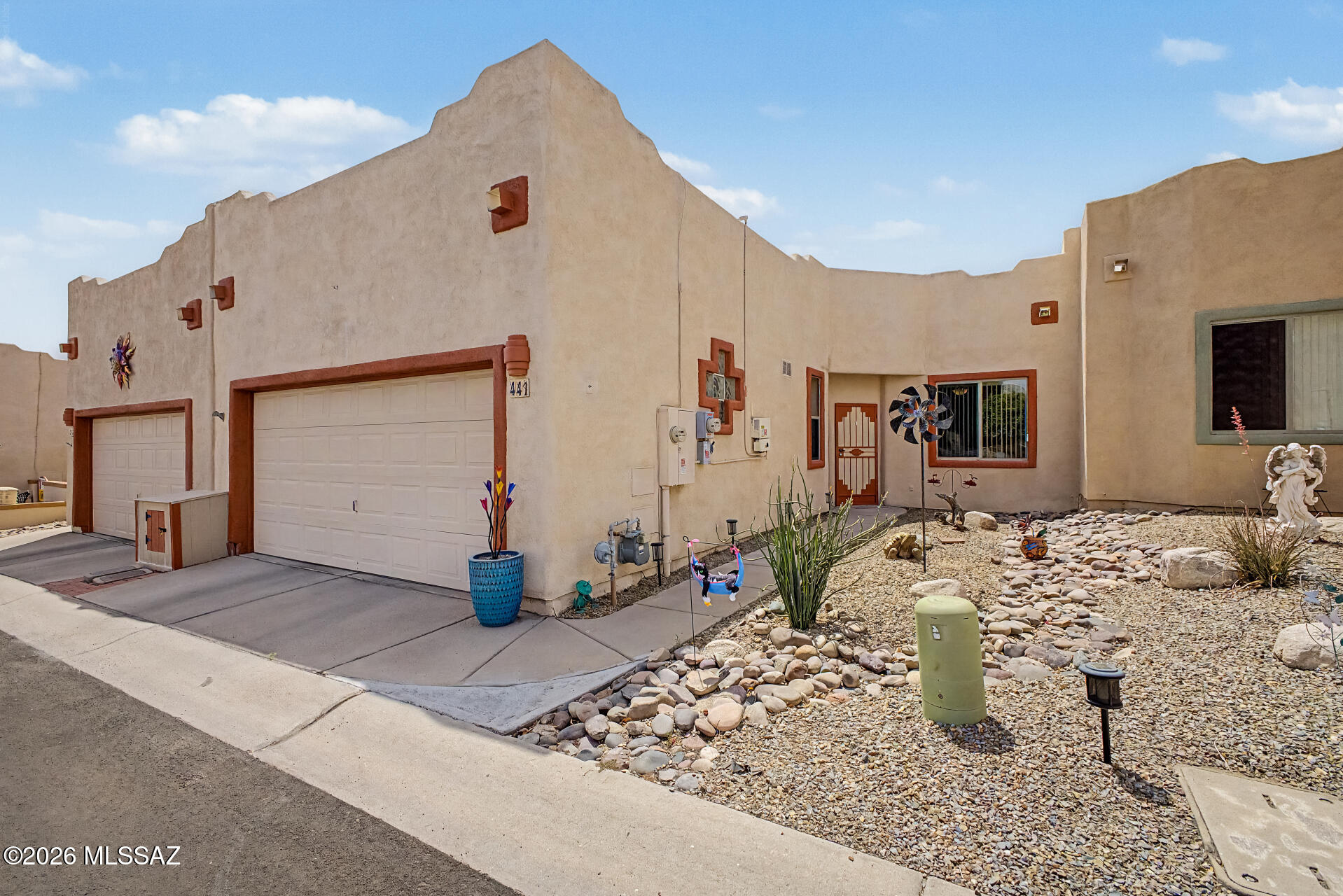 Priced To Sell! This beautiful 1,168 sq ft townhome offers comfort style and thoughtful updates throughout.Featuring 2bedroom, 2bathrooms, and a double car garage, this home is move in ready and full of value. Enjoy peace of mind with a roof recoat in 2026, owned solar installed in 2022. The exterior has been freshly painted, and the transferable home warranty adds even more convenience. Step inside to an inviting interior with a calm open feel. The kitchen features beautiful ceramic flooring, stainless steel appliances, and spacious pantry closet. Enjoy casual mornings in the cozy breakfast nook or host meals in the dining area just off the living room. Out back, the patio has been beautifully redone with brick pavers, decorative gravel, and mature desert landscaping perfect for relaxing or entertaining. Residents also enjoy access to the Canyon View clubhouse featuring a library of books and puzzles, a workout area, kitchen space, community events, salt water pool heated year round and much more. This home is not currently part of GVR giving you flexibility to join if you choose.Come take a look or schedule your showing today.