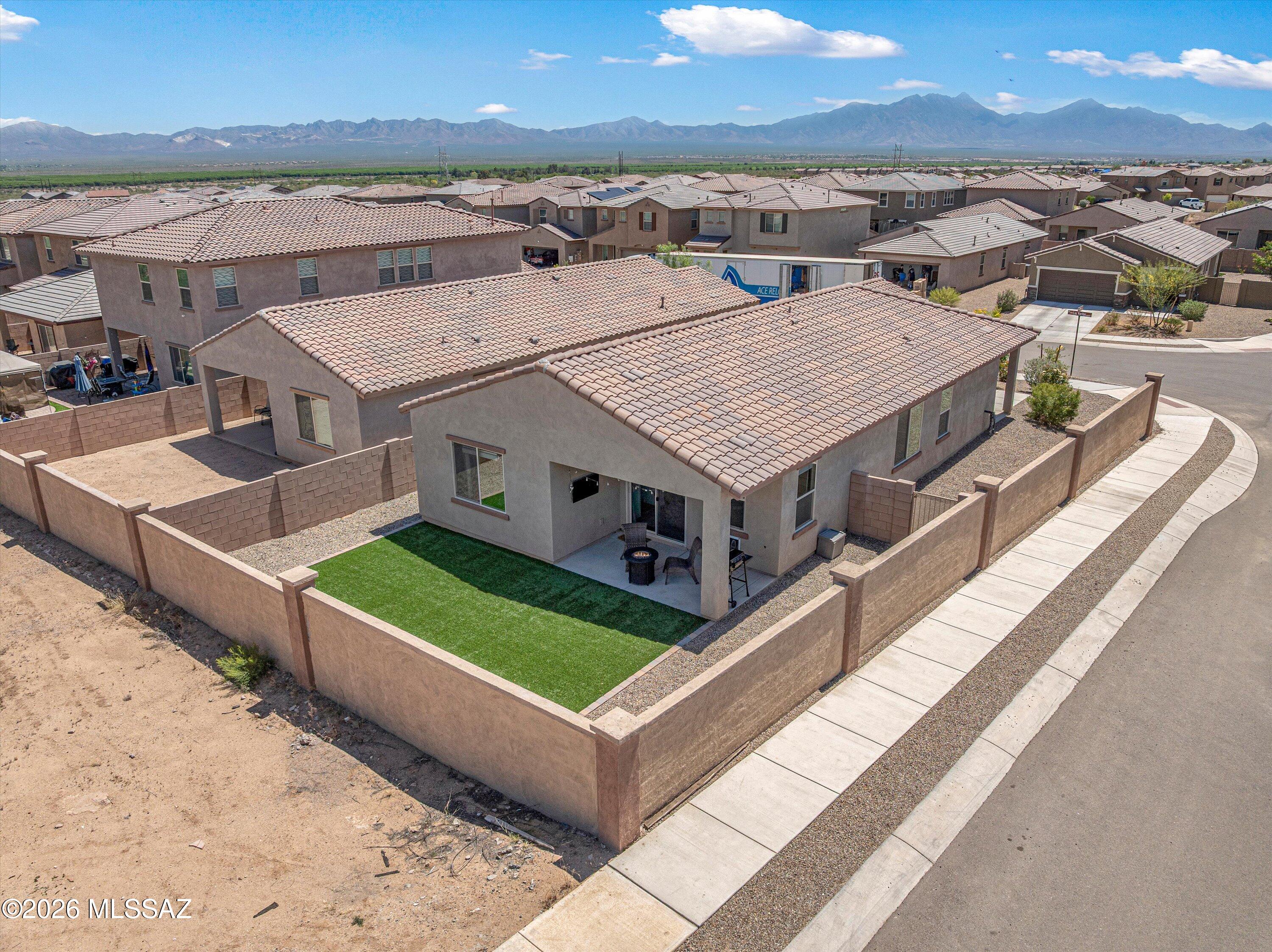 Practically new home with an open concept layout designed for hosting dinners and game nights! The split floorplan provides comfortable separation. Situated on a premium corner lot, with no neighbors behind. Enjoy all that Rancho Sahuarita has to offer, including a lake, community center with pool and fitness facilities, walking trails, and a vibrant, active lifestyle. Plus, a new community center is planned just a half mile away. Conveniently located near everyday shopping and amenities. This home is also available for purchase with possible seller credits to help with your closing costs.
