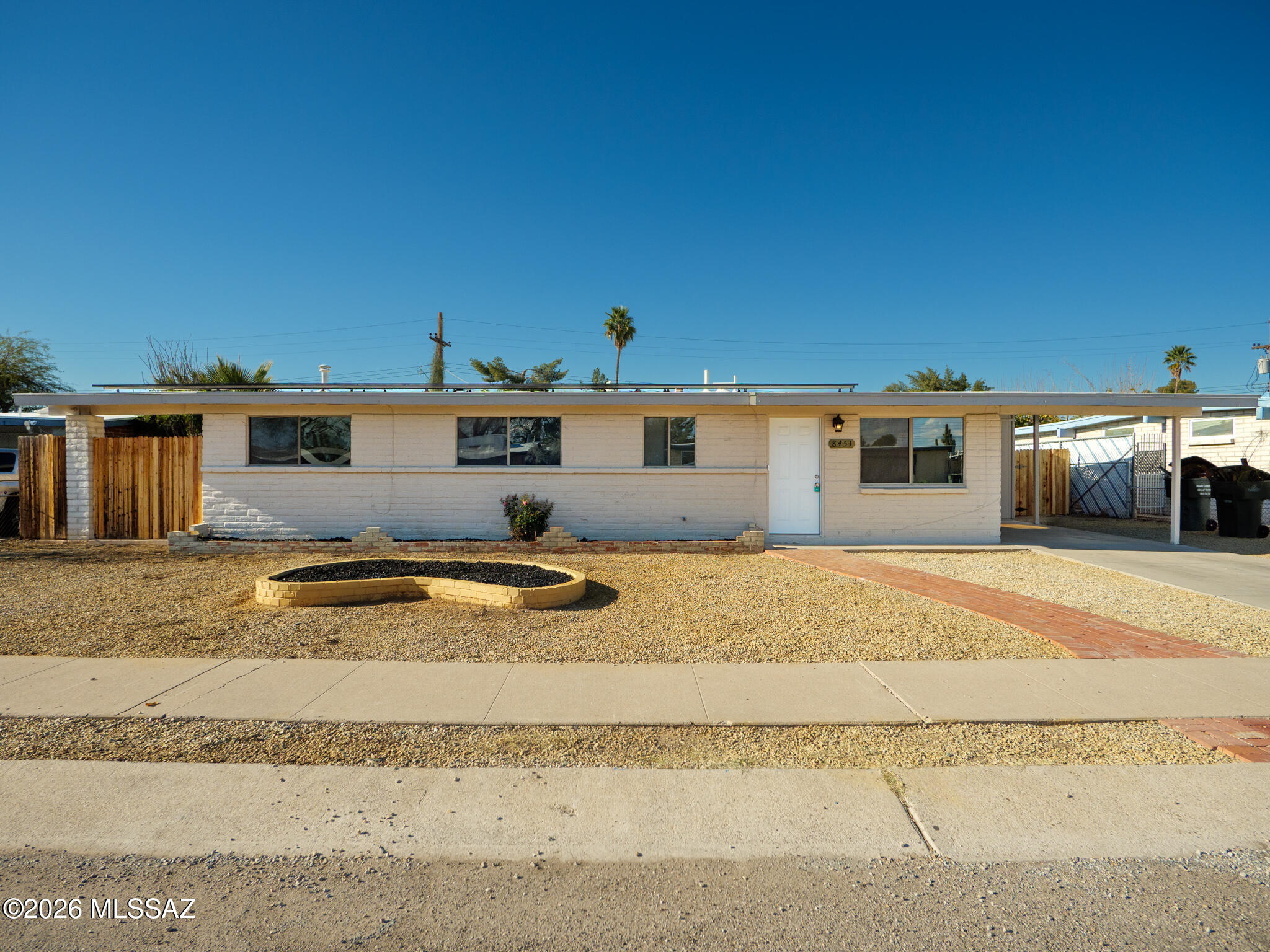 Text for a Walkthrough Video/more info. Updated One-story 3 Bedroom/2 Bathroom 1125sf Slump Block Home WITH SOLAR located on Tucson's Eastside. Amenities incl; Granite Countertops in the Kitchen; Oversized Master Bedroom Suite w/ Private Bathroom; Ceramic Tile Floors throughout; Central Air Conditioning; Laundry Room w/ Washer + Dryer incl; Car Port; and Large Private walled-in Backyard w/ Patio + Storage Shed (NOT weather-proof). 1yr minimum Lease, Costs are; Non-refundable $50/adult Application, $1725 Security Deposit, $150/pet with approved pet, $400 cleaning. Tenant pays electric, nat gas, water/sewer/trash.