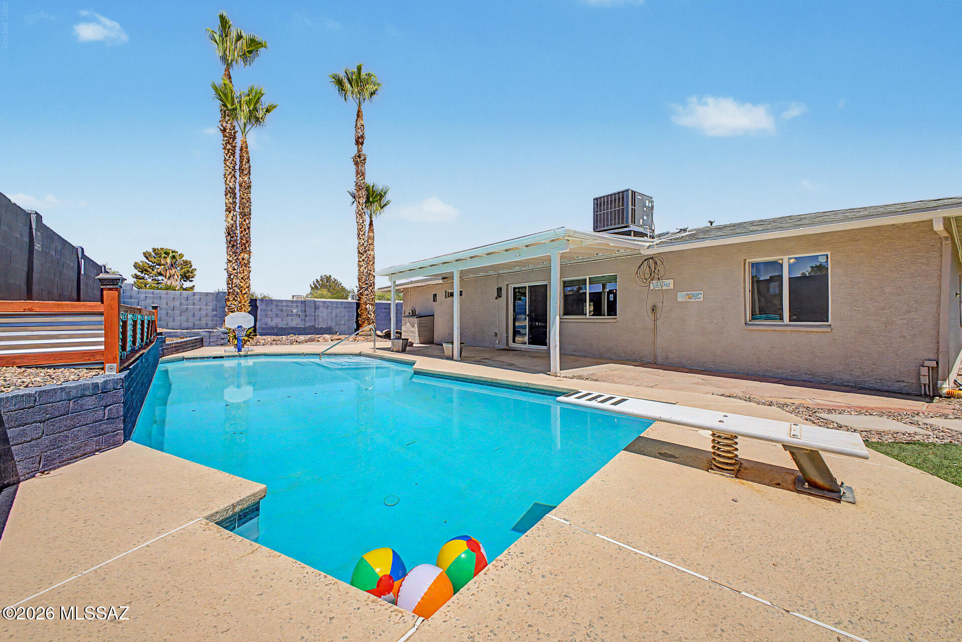 Welcome to Poolside Paradise on the East Side! 

Where every day feels like summer. Situated on a premium corner lot with beautiful mountain views from the front, this home welcomes you with an open, light-filled floor plan, stunning brick accent walls, and an inviting kitchen designed for gathering. The remodeled primary bath, spacious layout, and thoughtful design create the perfect blend of comfort and privacy. Step outside to your private backyard oasis featuring a sparkling pool, lush turf, and an extended covered patio with misters, perfect for relaxing or entertaining all season long. Don't let summer pass you by without making this East Side gem your own!