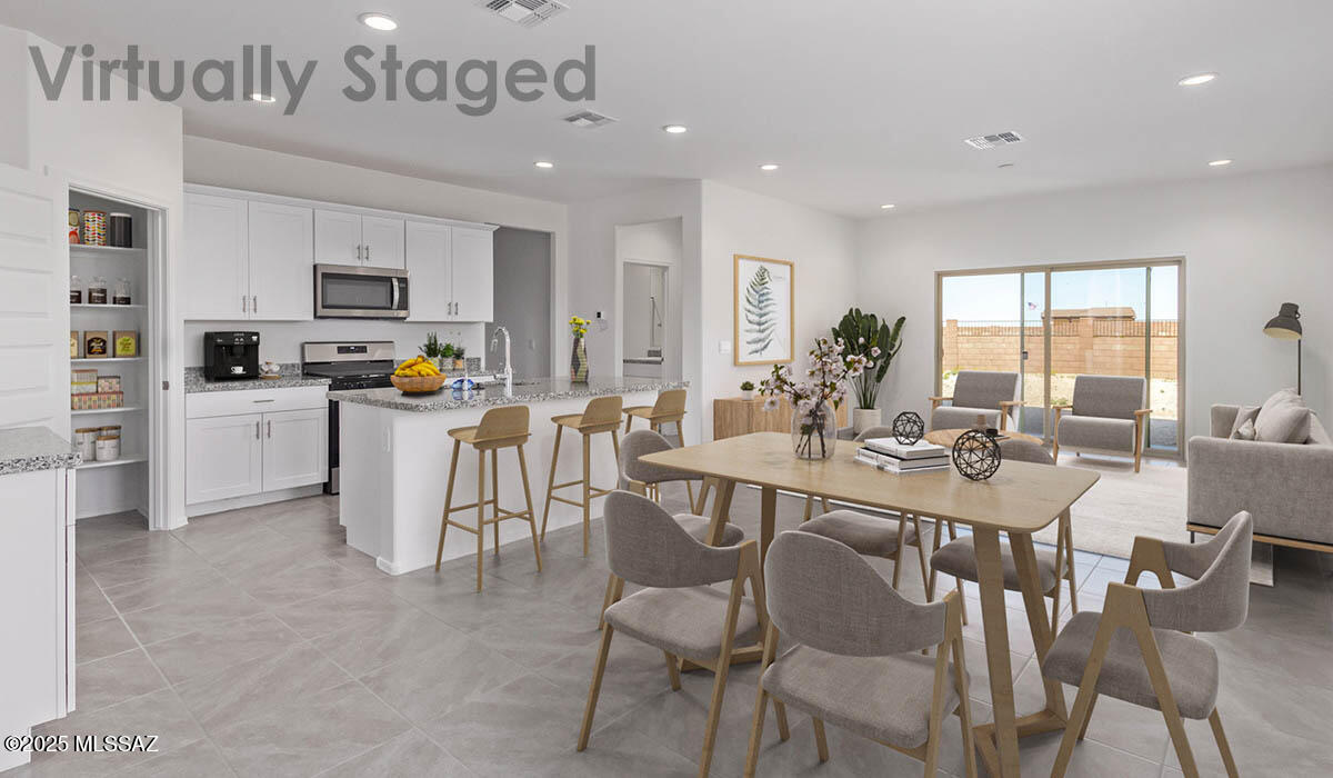 Discover the Madison at Hanson Ridge in Vail, Arizona - A beautifully designed 2,522 sq. ft. two-story new home that seamlessly blends functionality with style, offering a perfect retreat within the stunning desert landscape.

As you step through the welcoming front porch, you're greeted by a spacious entryway that leads directly into the heart of the home. The main floor is thoughtfully laid out to accommodate both everyday living and special occasions. The expansive great room opens into the dining area and the kitchen, creating a central hub for family gatherings and entertaining. The kitchen features Quartz countertops, upgraded cabinets, modern appliances, and a large walk-in pantry, ensuring that both style and practicality are well met.  Under Construction.