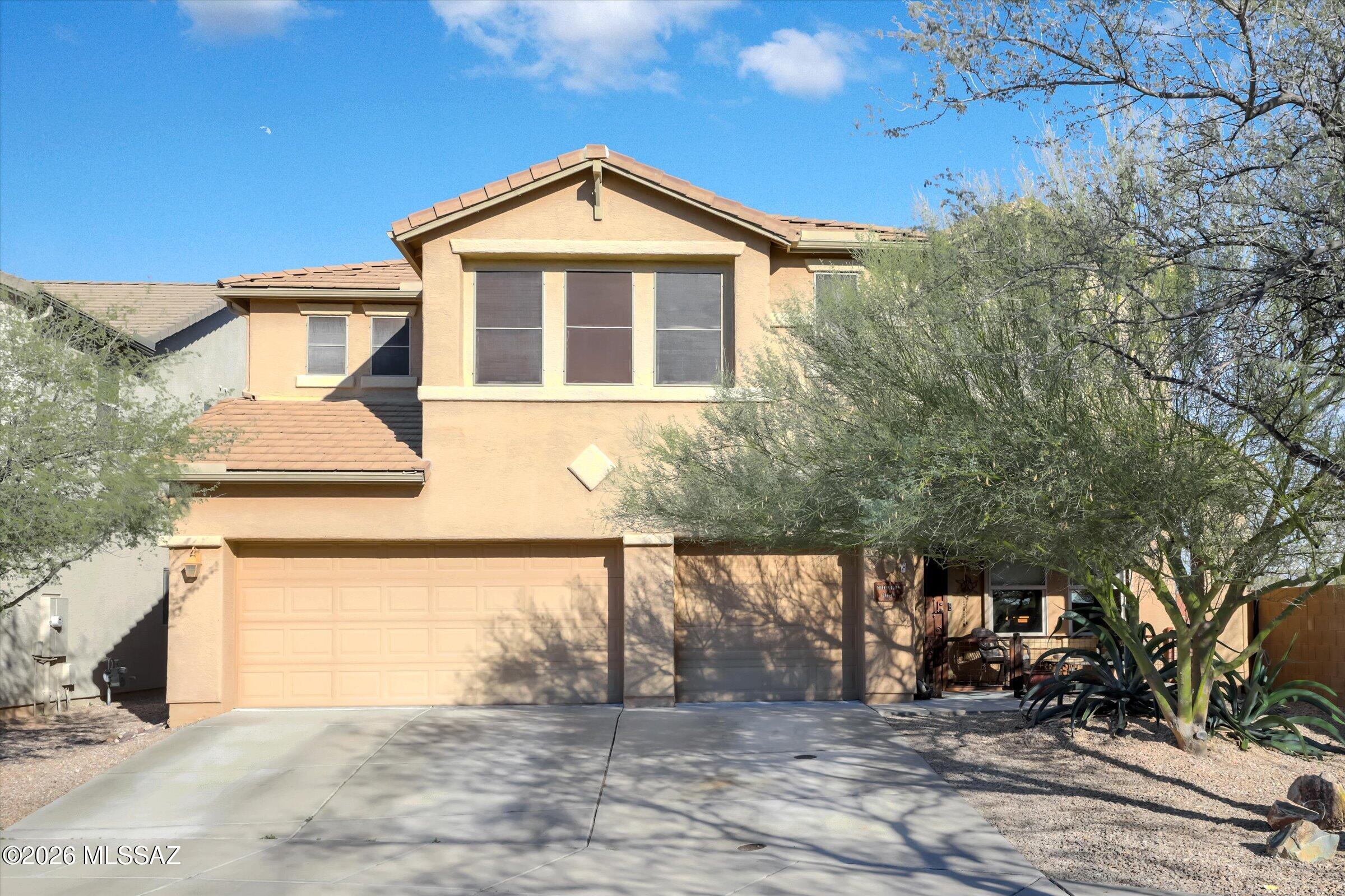 4071 sf BIG and WONDERFUL!  This 5 bed/4 bath home has it all!  Downstairs has a bedroom next to full bathroom, security rolling shutters on all downstairs windows,(blackout), family room, great room and under the stairs storage. The kitchen has mountain views and the pantry... well the pantry is so BIG it has a refrigerator in it! Upstairs has the primary bedroom (with a HUGE closet!), 3 more bedrooms one of which is an ensuite.   The LOFT, yep pool tables fit here! The backyard views are of Saguaro NP, the Santa Ritas and the Catalinas all from the pool, it even comes with a grass area and fireplace! Don't miss the fact it has a 3 car garage on a cul de sac! There are parks, walking paths, and community pool! THE LOOP is less than a mile and all in the VAIL SCHOOL DISTRICT!  Don't wait!