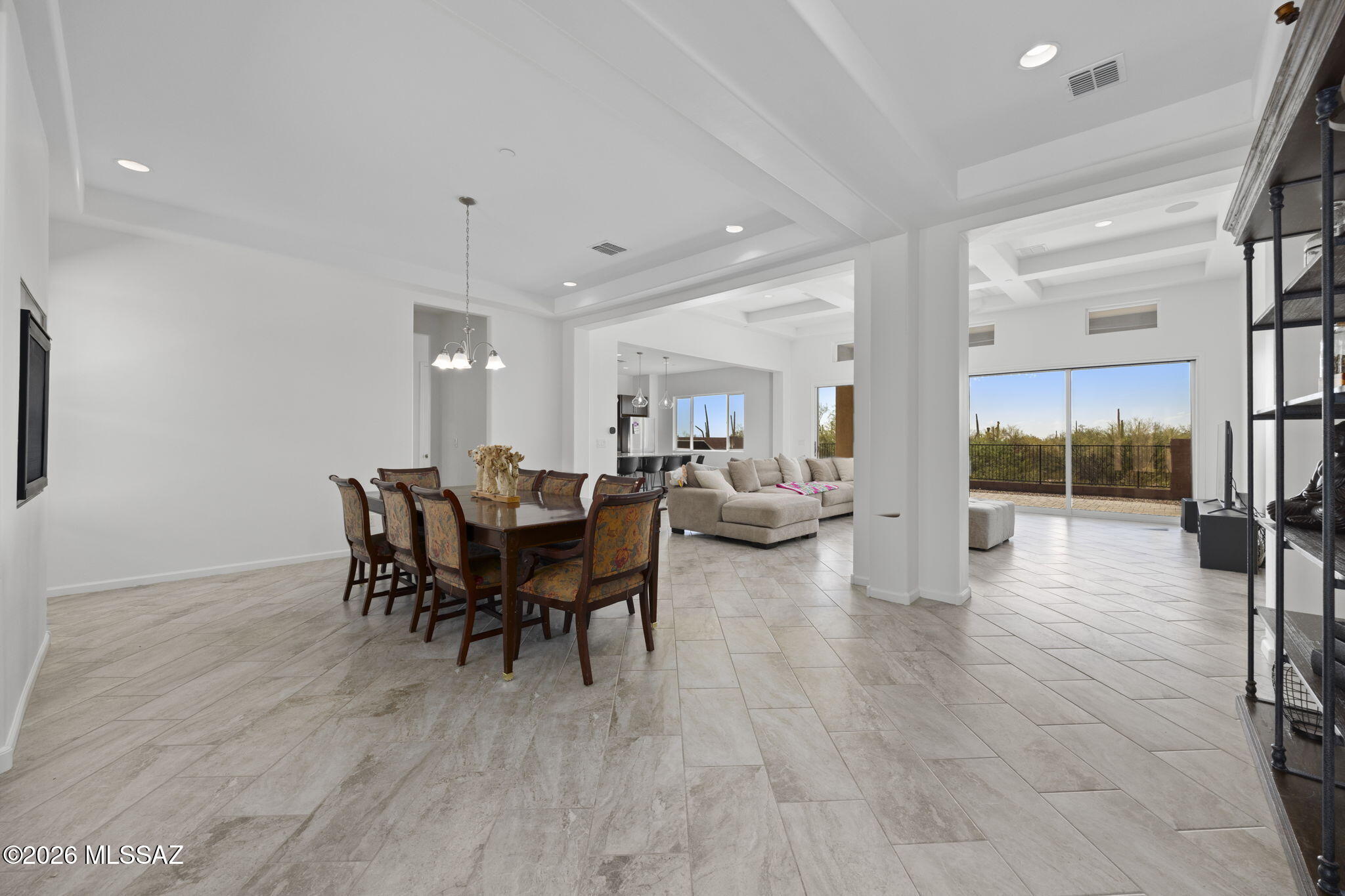 Nestled in Marana's prestigious Dove Mountain, this 3,032 sq ft 4 bed/3.5 bath home offers spectacular Sonoran Desert living. Framed by unobstructed, panoramic sunset views with privacy and no neighbors behind, the premium lot integrates seamlessly with nature through your expansive courtyard slider.
Inside, meticulously curated upgrades elevate daily living. The gourmet kitchen features large center island, butler's pantry, complemented by a custom drop zone, dedicated office/den, and a 3-car tandem garage. Guests enjoy ultimate privacy in a rare second en-suite bedroom. Enjoy sophisticated modern design with serene desert tranquility in a resort setting. Minutes from The Golf Clubs@ Dove Mountain, Amazing trail systems, and ''A'' rated CSTEM K-8 schools; Call today for a private showing