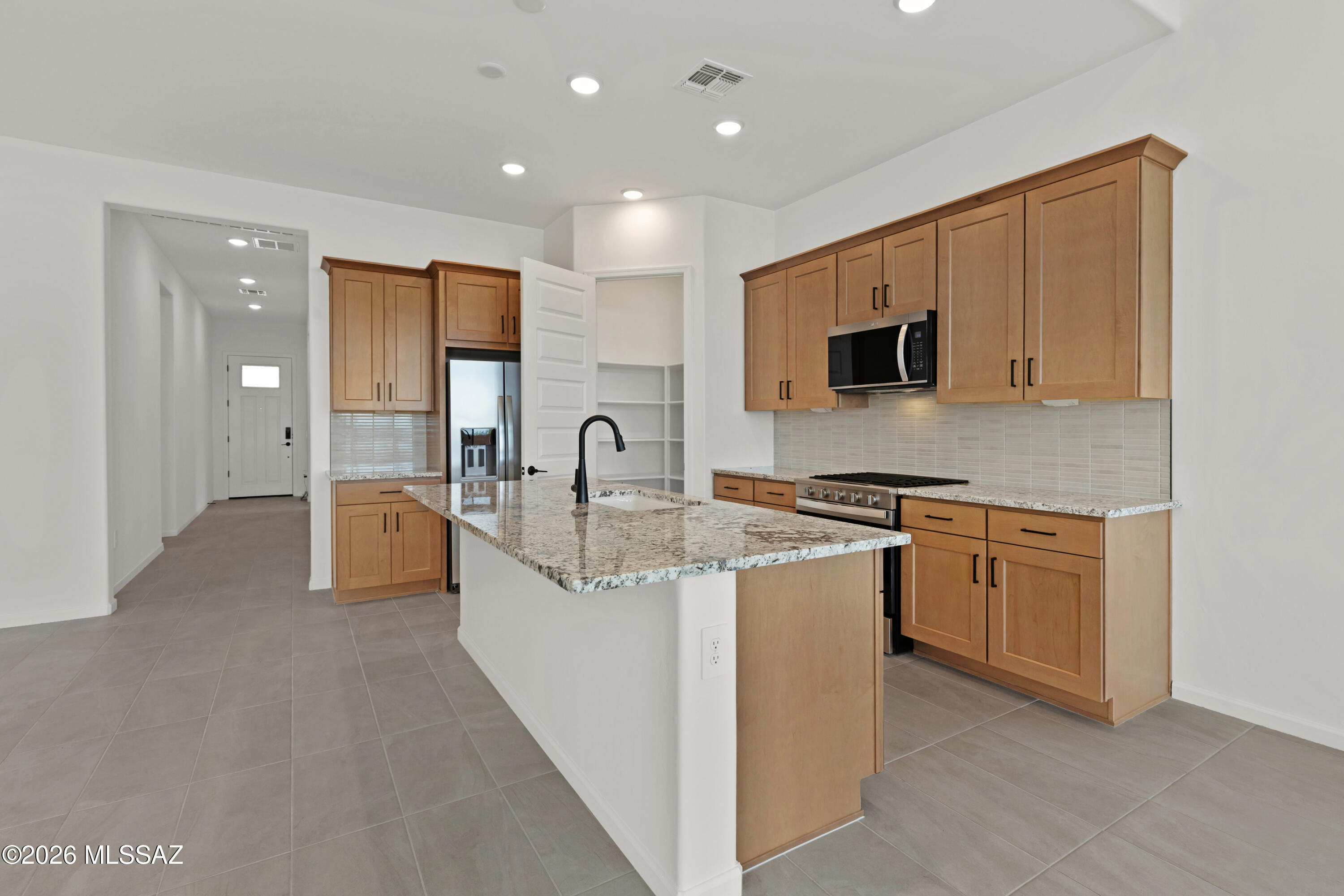 Charming Copper plan with Ranch elevation. Thoughtfully designed open Greatroom layout with spacious dining area & kitchen. 3 bedrooms and 2 full baths. Owner's suite is a true retreat with generously sized walk-in closet, walk-in shower, vanity with twin sinks and view to backyard. The modern kitchen is equipped with a gas range, Whirlpool refrigerator, center island and a walk-in pantry for all your culinary needs. Laundry room is complete with Washer/Dryer. Includes faux wood blinds & Backyard landscaping.