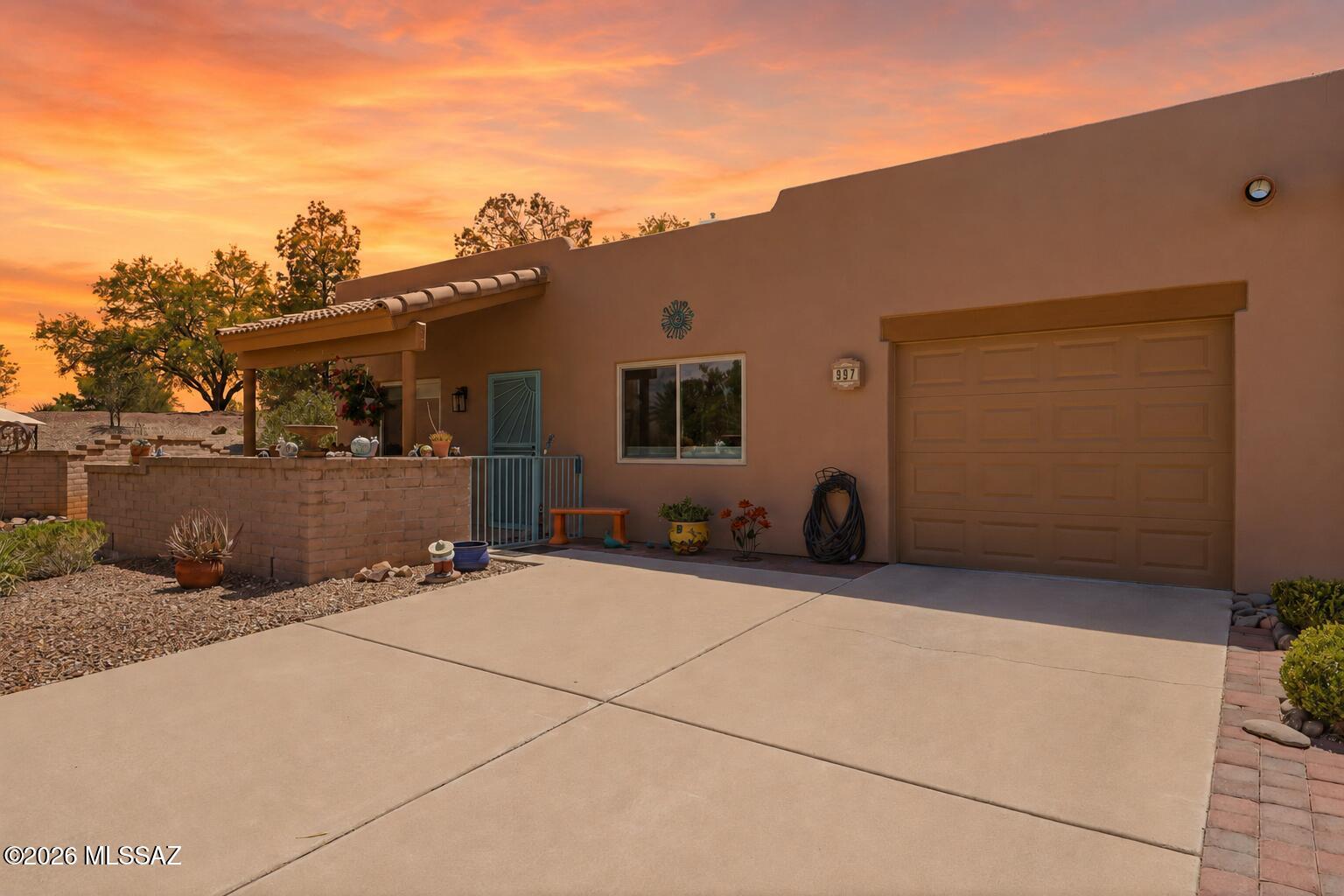 Turnkey 1BR/1BA townhome on a quiet semi-cul-de-sac and no rear neighbors. Brand-new water heater (2025), recent full bathroom and bedroom remodel, and new windows. Attached 1-car garage plus a 2-car driveway. All appliances under 5 years old with the washer/dryer included. The bedroom features a sliding barn door and spacious walk-in closet. The home has been thoughtfully decorated with hand-selected art pieces from different artists around the world. Furniture is available via SBOS. Both the front and rear yards have covered patios and custom pavers. Walkable distance to the Santa Rita GVR rec center. Community amenities include a pool, spa, fitness center, and walking trails. Enjoy nearby shopping centers, restaurants, and golf courses. This one will go quick!