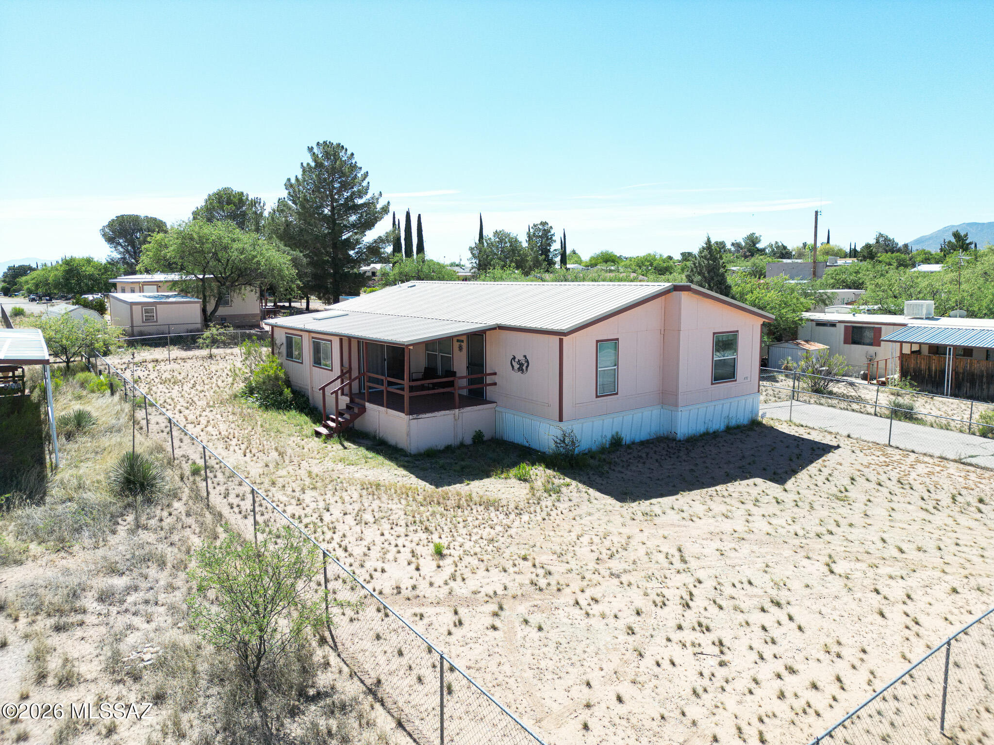 Well loved home, ready for next lucky homeowner!  Three bedrooms, two baths, PLUS Spa room!   All kitchen appliances, plus Washer and Dryer too.  Chain link fenced, with RV Drive-in gate.  Storage Shed/workshop.    Just minutes from I-10 for quick and easy commutes to town and Tucson and Sierra Vista, but far from highway noise.
