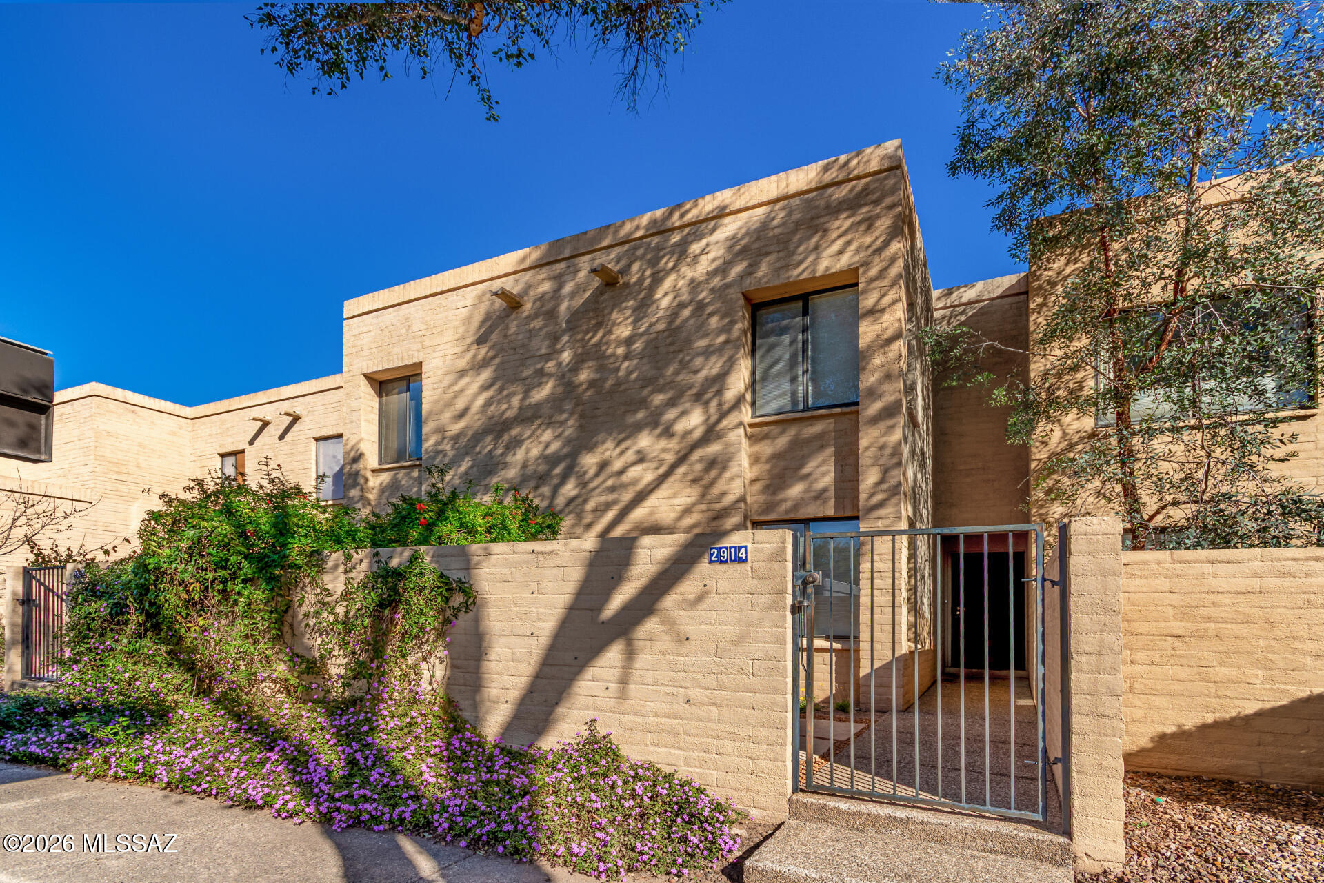Welcome to Tamarisk Townhomes, a hidden gem in Tucson's Riverbend area. This well-maintained, 1,887 sq. ft. home offers 3 beds, 3 baths, and one of the largest floorplans in the community. Enjoy cozy fireplaces in both the living room and primary suite. Outside, your private backyard oasis awaits—perfect for entertaining year-round. Residents enjoy a community pool and spa. Ideally situated for outdoor enthusiasts, the home sits off Treat Ave—a major bikeway—and is moments from The Loop and the Tucson Racquet Club. Two parking spaces are available for owner use - one covered, one uncovered. With easy access to shopping, schools, and Rio Vista Natural Resource Park, this spacious residence offers the perfect blend of comfort and prime location.