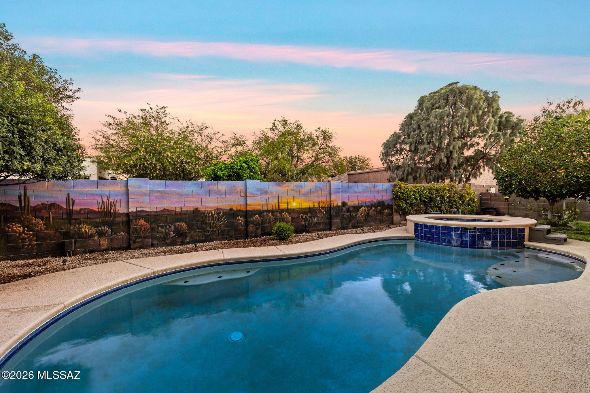 Stunning example of why HallCraft homes was one of the best in Gladden Farms! Over 2800 sf of living space, with 4 bedrooms, 2 1/2 bathrooms and a desirable 3 car garage. This home has it all. Large open concept. Main level primary suite with access to pool and spa for those AZ evenings. No carpet throughout main level with custom tile and laminate flooring. Solid surface counters compliment the large entertainer's kitchen space with large pantry. Side yard offers extra room to play, and mature landscaping give the final touches to this backyard oasis. Downstairs has large Den and 1/2 bath option while the upper floor has a large loft area and built in media for movie night. Come see all that this home has to offer!