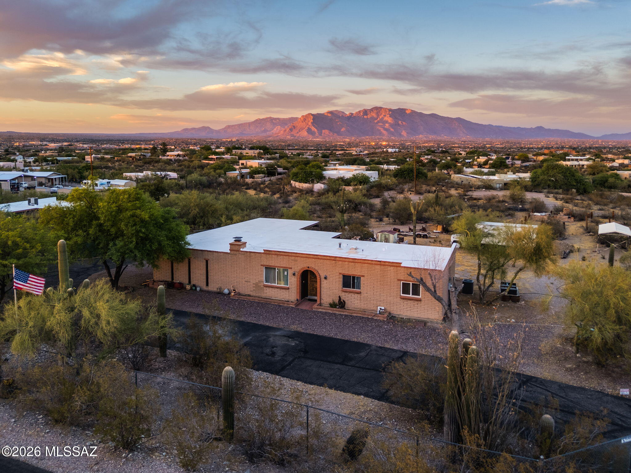 Classic ranch, perfectly situated on an elevated lot just over one acre, offers panoramic views of the mountains, city lights, sunrises, and sunsets. Featuring 3 bedrooms and 2 bathrooms, the home offers a comfortable layout with a cozy living room fireplace and a dining area conveniently located just off the kitchen. Some updates have already been completed, while leaving room for the next owner to bring their own vision and personal touches to make it truly shine. Outside, you'll find plenty of parking and versatility with a 2-car attached garage, and 4 additional covered parking spaces including a dedicated space for RV parking. Perfect opportunity to enjoy space, scenery, and endless potential all in one property.