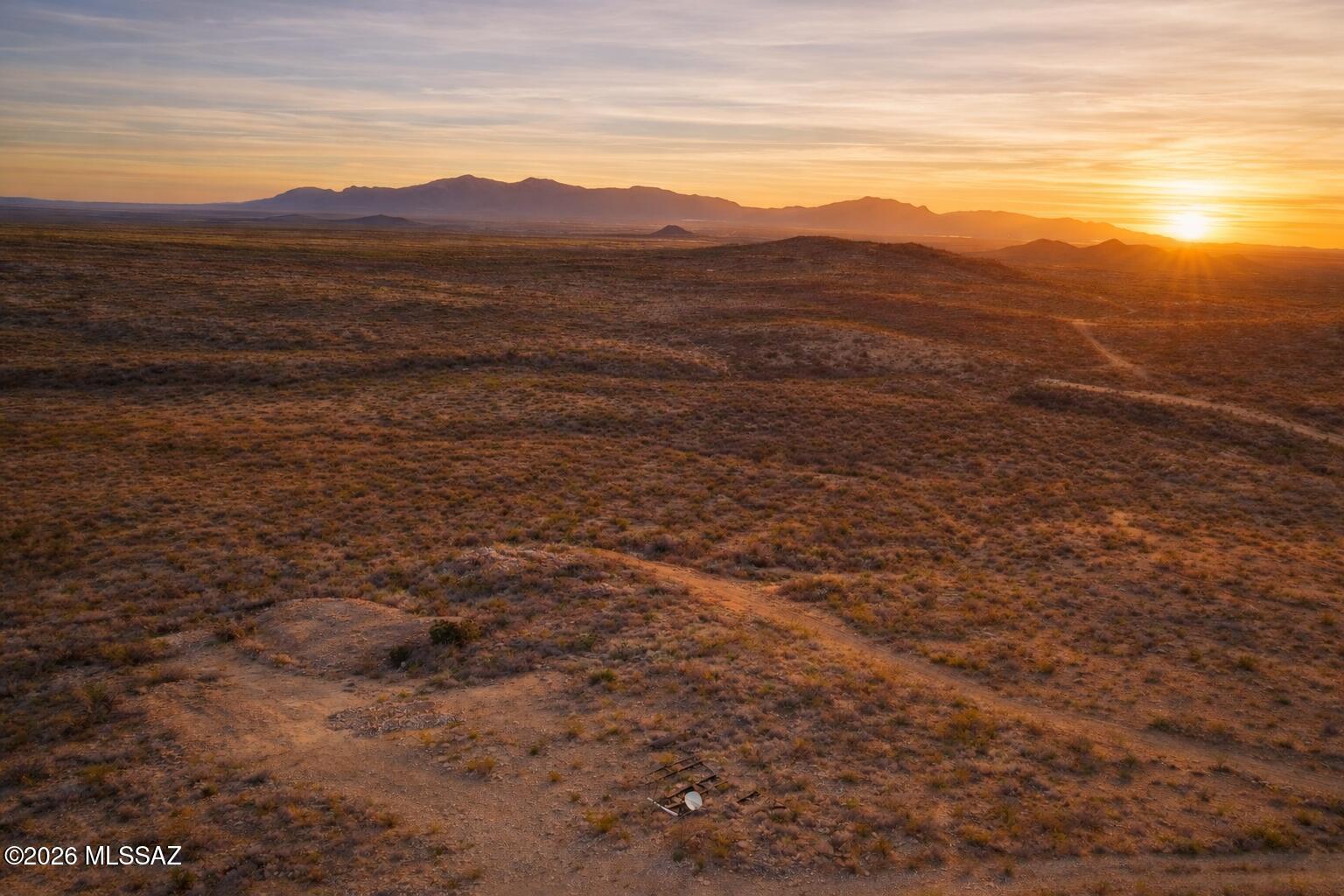 This listing isn't just land—it's history. Five patented mining claims in the legendary Tombstone Mining District, where silver once fueled the dreams of the Old West. 66.7 total acres, non-contiguous parcels, sold together as one rare collection. Historic surveys from 1881-1883 reference fifteen mine shafts, lasting imprints of early prospectors. The Tombstone Claim (19.69 acres, Feb 1882) is surrounded by BLM land and benefits from an active Right-of-Way Grant. The Big Pedro & Little Pedro Claims total 27.04 acres (July 1881). The Aurora Claim spans 18.87 acres (Aug 1883). The Laura English Claim (1.14 acres, July 1883) sits directly on paved Charleston Road. Vast views, raw desert beauty, and true frontier legacy—five historic claims, one chance to own the past.