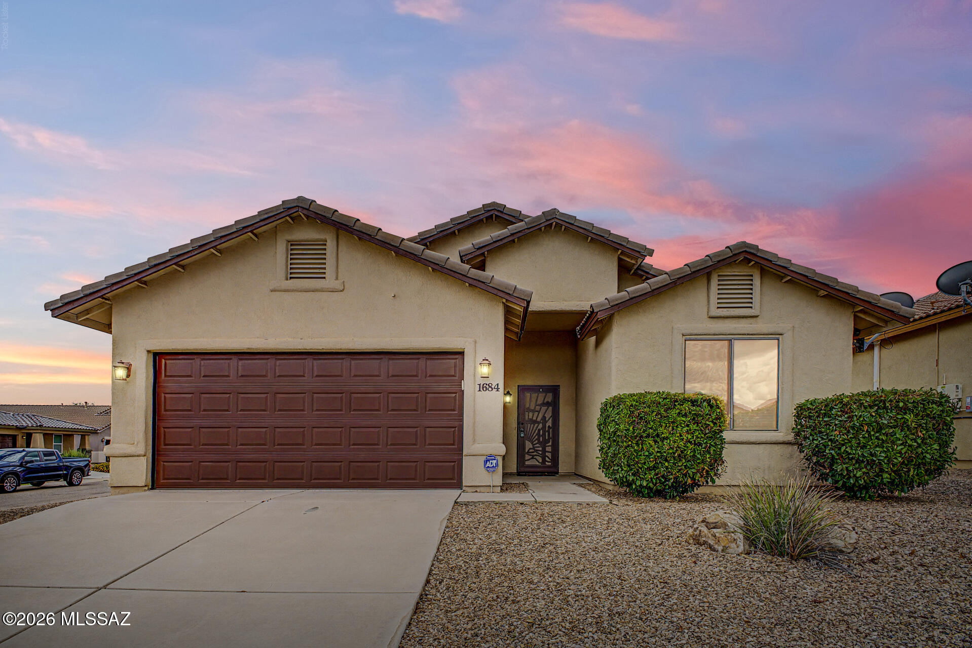 Welcome to this beautifully crafted 3-bedroom, 2-bath home in the desirable Canyons at Whetstone Subdivision, built by renowned RL Workman Homes. Situated on a premium corner lot with open space behind, this exceptional property offers added privacy and picturesque surroundings. Located only a 30-40 minute drive to Tombstone, Sierra Vista, Wilcox and Tucson!
Inside, you'll find an open, inviting floor plan with soaring ceilings that enhance the home's spacious feel. The well-appointed kitchen features granite countertops, a center island, an upgraded gas range, and a Bluetooth-enabled microwave with convection and air-fry capabilities--perfect for both everyday living and entertaining. Additional upgrades include a water softener, a custom front security screen door, and a cozy gas fireplace. A double-wide, impact-resistant glass door opens to the stunning Arizona Room, creating the perfect indoor-outdoor living experience.
The beautifully landscaped backyard is designed for low-maintenance enjoyment with decorative rock, artificial turf, and two storage sheds, providing ample space for tools, hobbies, or seasonal items. This quality-built home combines comfort, thoughtful upgrades, and an ideal location, making it a must-see.
