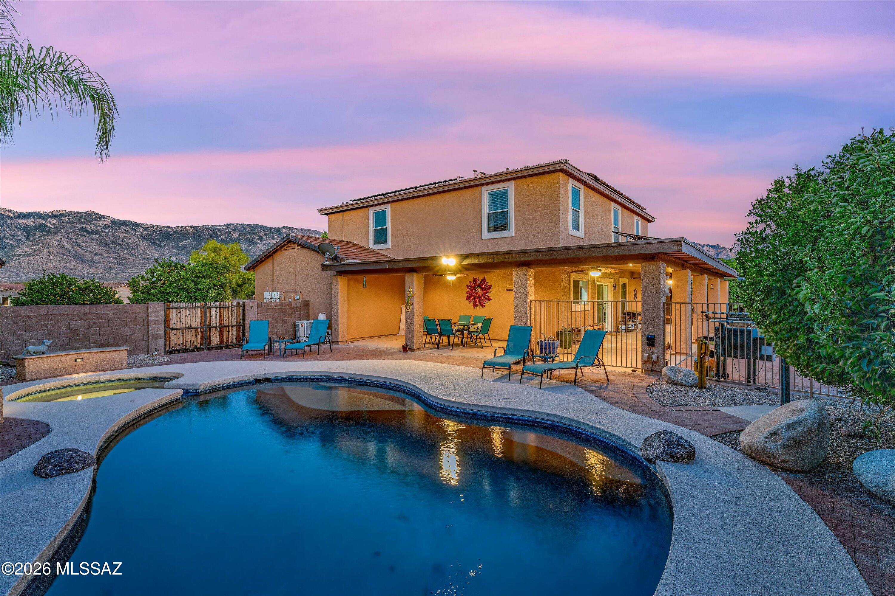 A four-bedroom home with a heated pool, a spa, and a 3 car garage, under $500k! This is a rare find indeed! Welcome to this stunning retreat nestled in the desirable Blackhorse Ranch community of Catalina on a quiet cul-de-sac.
Offering 2,760 square feet of thoughtfully designed living space on a 0.20-acre lot, this home delivers an exceptional combination of mountain views, modern updates, low-cost living, and resort-style outdoor amenities -- all under $500,000.

Rare Financing Opportunity - Take advantage of an assumable VA loan at just 3.625% -- a significant advantage in today's market. Ask for details! 

This home is also equipped with a robust solar system, covering the electric needs of the home year round. The solar loan may be assumed by qualified buyer. Your Private Backyard Oasis - Step outside to a heated pool and hot tub, a freshly resurfaced pool deck, a lush real grass yard with full irrigation, and a large covered patio perfect for outdoor dining and entertaining year-round. Enjoy the mature fruit trees: pomegranate, orange, pear, Mexican lemon, and grapevines!
Move-In Ready with Major Updates Done!
No carpet throughout -- beautiful ceramic tile and LVT flooring in every room.
Brand new HVAC/furnace (2025) with a 10-year transferrable warranty.
Freshly painted exterior (2026) with a 10-year transferrable warranty.
New hot water heater (2024).
Pool pump replaced (2023) & pool deck resurfaced with Cool Touch decking (2026).
With a spacious 3-car garage, 4 bedrooms, and a backyard built for entertaining, this Blackhorse Ranch gem checks every box. Move in with confidence -- the big-ticket items are already handled.